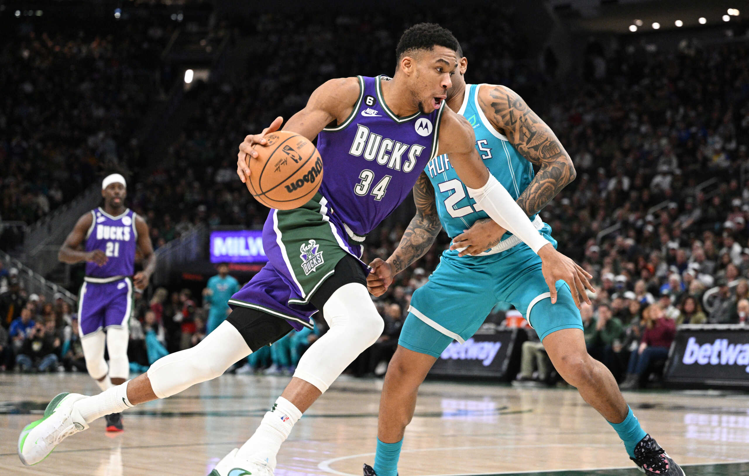 Jan 6, 2023; Milwaukee, Wisconsin, USA; Milwaukee Bucks forward Giannis Antetokounmpo (34) drives to the basket against Charlotte Hornets forward P.J. Washington (25) in the first half at Fiserv Forum. Mandatory Credit: Michael McLoone-USA TODAY Sports