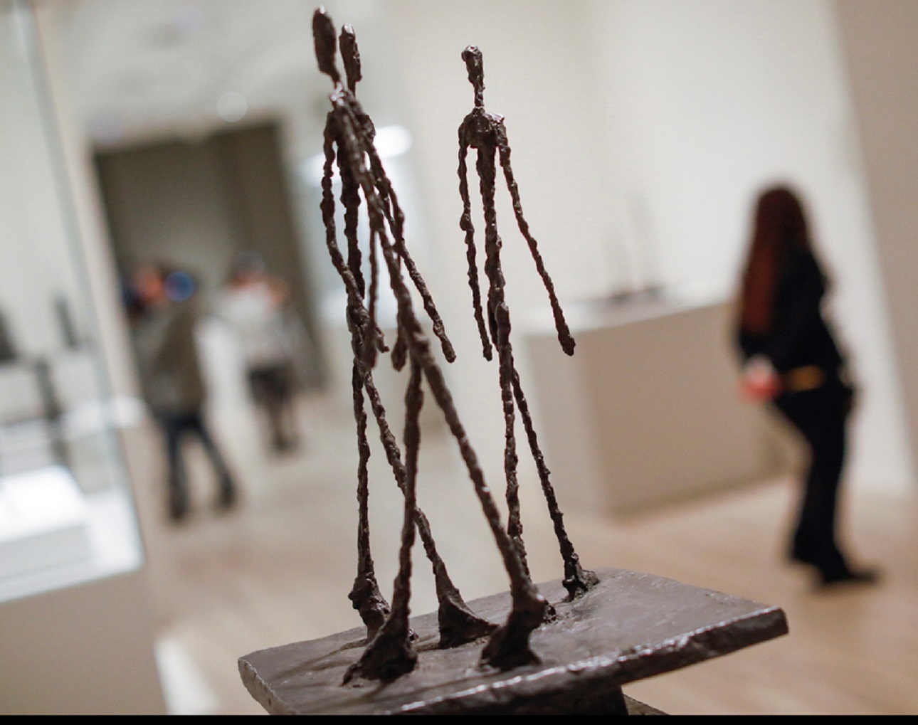epa08192213 The sculpture 'Three Walking Men' by Swiss artist Alberto Giacometti is on display in the exhibition 'Rodin-Giacometti' at the Mapfre Foundation in Madrid, 04 february 2020. The exhibition will open to public from 06 February to 10 May 2020.  EPA