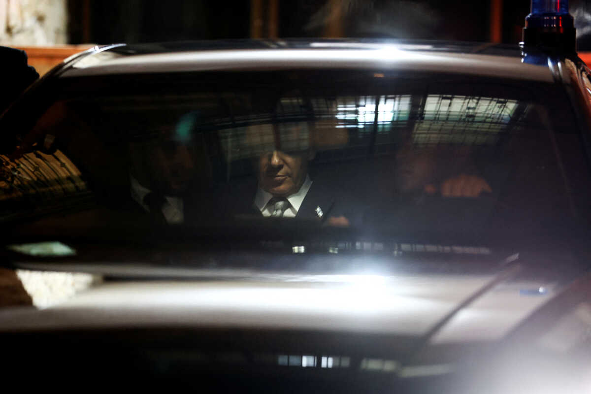 Israeli Prime Minister Benjamin Netanyahu sits in his car after he visited Interior and Health Minister's Aryeh Deri home in Jerusalem, January 18, 2023. REUTERS