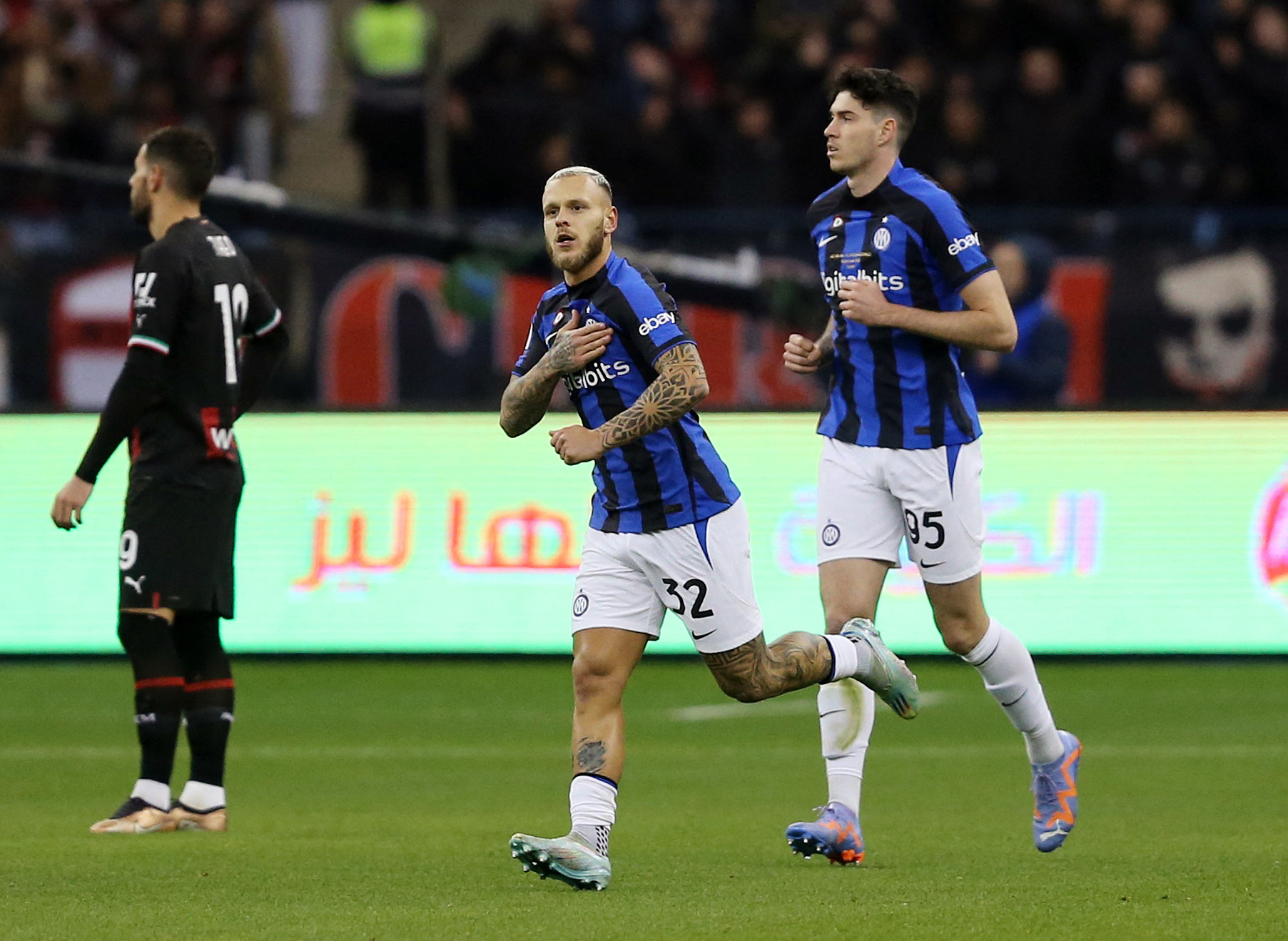 Soccer Football - Italian Super Cup - Final - AC Milan v Inter Milan - King Fahd Stadium, Riyadh, Saudi Arabia - January 18, 2023 Inter Milan's Federico Dimarco celebrates scoring their first goal with Alessandro Bastoni REUTERS