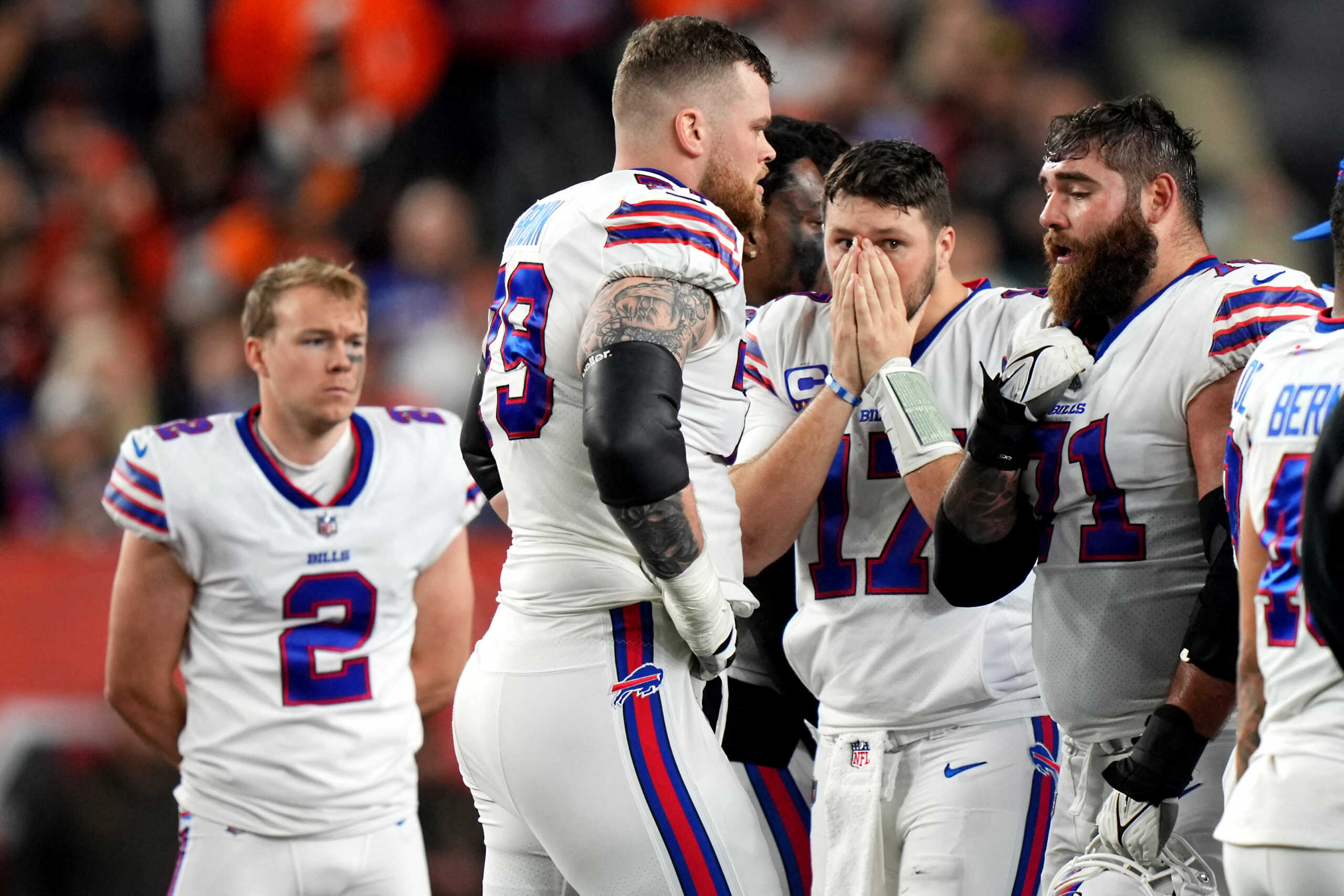 Jan 2, 2023; Cincinnati, Ohio, USA; Buffalo Bills quarterback Josh Allen (17) and the Buffalo Bills react as Buffalo Bills safety Damar Hamlin (3) is tended to on the field after a collision in the first quarter against the Cincinnati Bengals at Paycor Stadium. Mandatory Credit: Kareem Elgazzar-USA TODAY Sports
