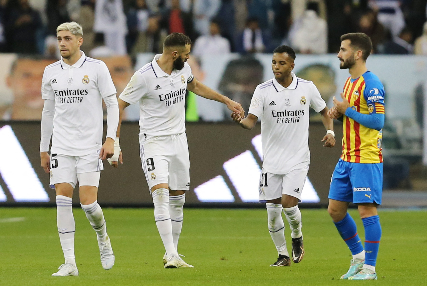 Soccer Football - Spanish Super Cup - Semi Final - Valencia v Real Madrid - King Fahd Stadium, Riyadh, Saudi Arabia - January 11, 2023 Real Madrid's Karim Benzema celebrates scoring their first goal with Rodrygo and Federico Valverde REUTERS
