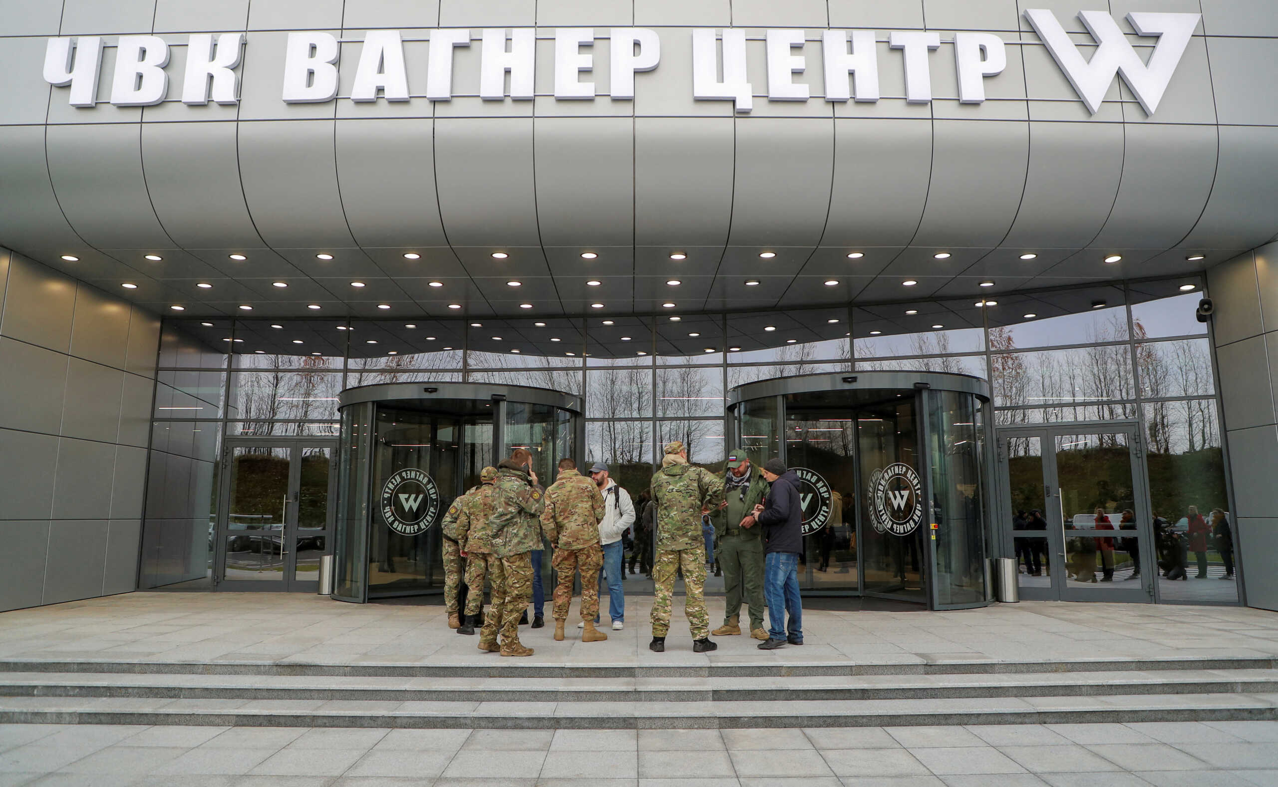 FILE PHOTO: Visitors gather outside PMC Wagner Centre, which is a project implemented by the businessman and founder of the Wagner private military group Yevgeny Prigozhin, during the official opening of the office block in Saint Petersburg, Russia, November 4, 2022. REUTERS