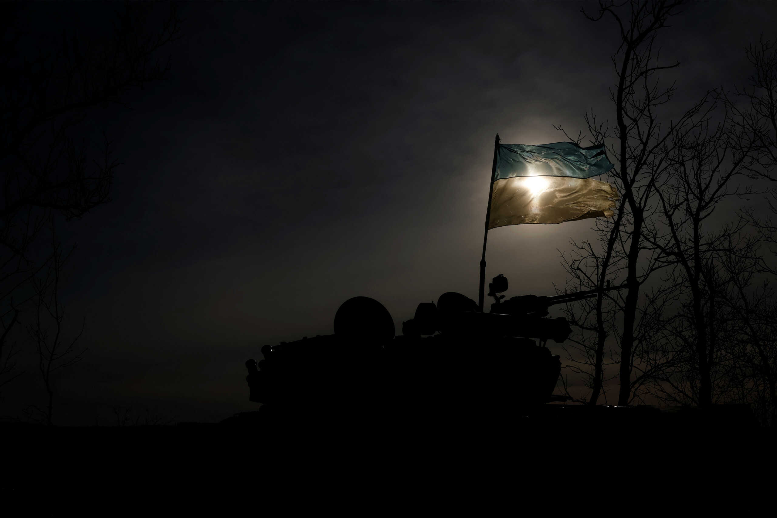 A Ukrainian flag flutters in the wind affixed to a tank, as Russia's attack on Ukraine continues, overlooking Bakhmut, Ukraine, January 10, 2023. REUTERS