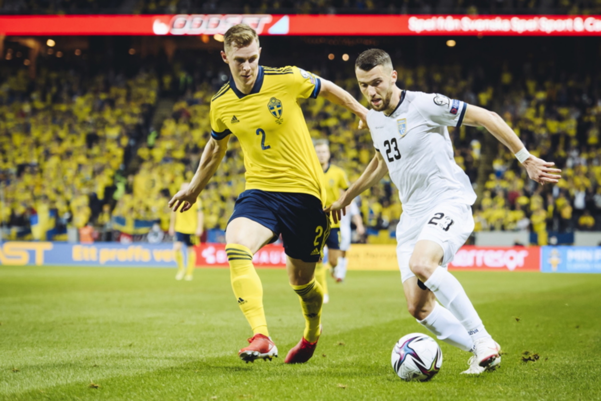 epa09515297 Sweden's Emil Krafth (L) and Kosovo's Zymer Bytyqi in action during the FIFA World Cup 2022 Group B qualifying soccer match between Sweden and Kosovo at Friends Arena in Stockholm, Sweden, 09 October 2021.  EPA