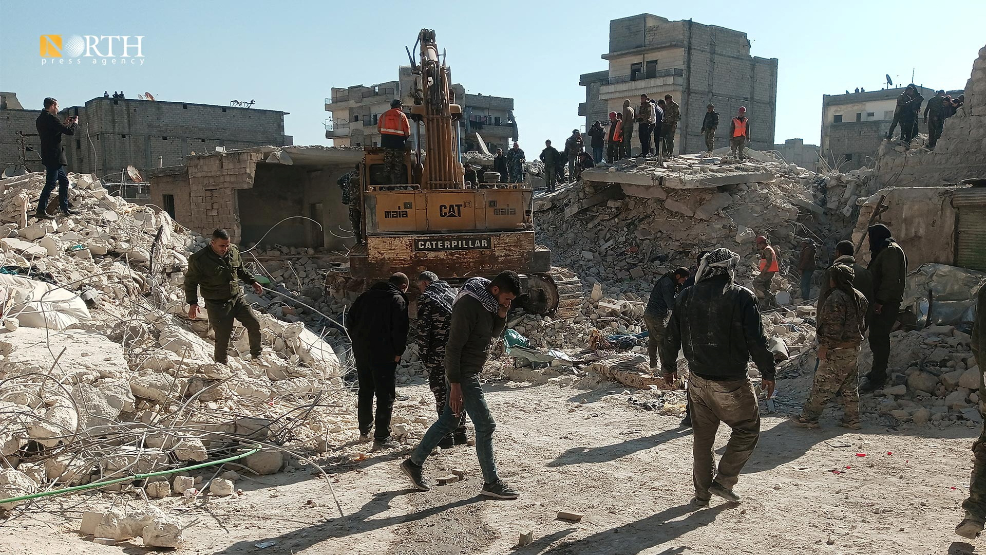Members of a rescue team work on the scene of a residential building collapse in the Sheikh Maksoud neighbourhood of Aleppo, Syria January 22, 2023. North Press Agency