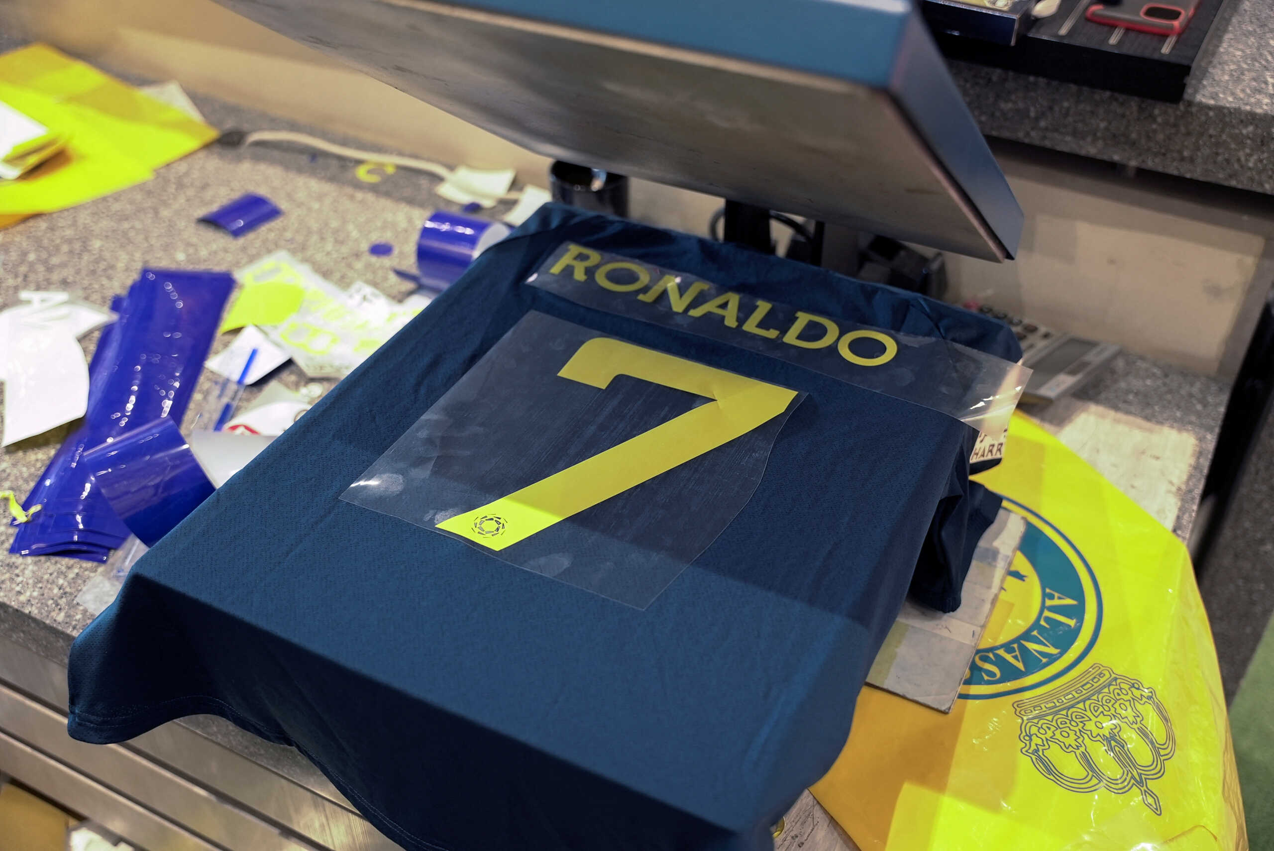 A general view of an Al Nassr soccer jersey and Cristiano Ronaldo's surname and number on a heat press, after it was announced the player has signed a contract with the club, in Riyadh, Saudi Arabia December 31, 2022. REUTERS