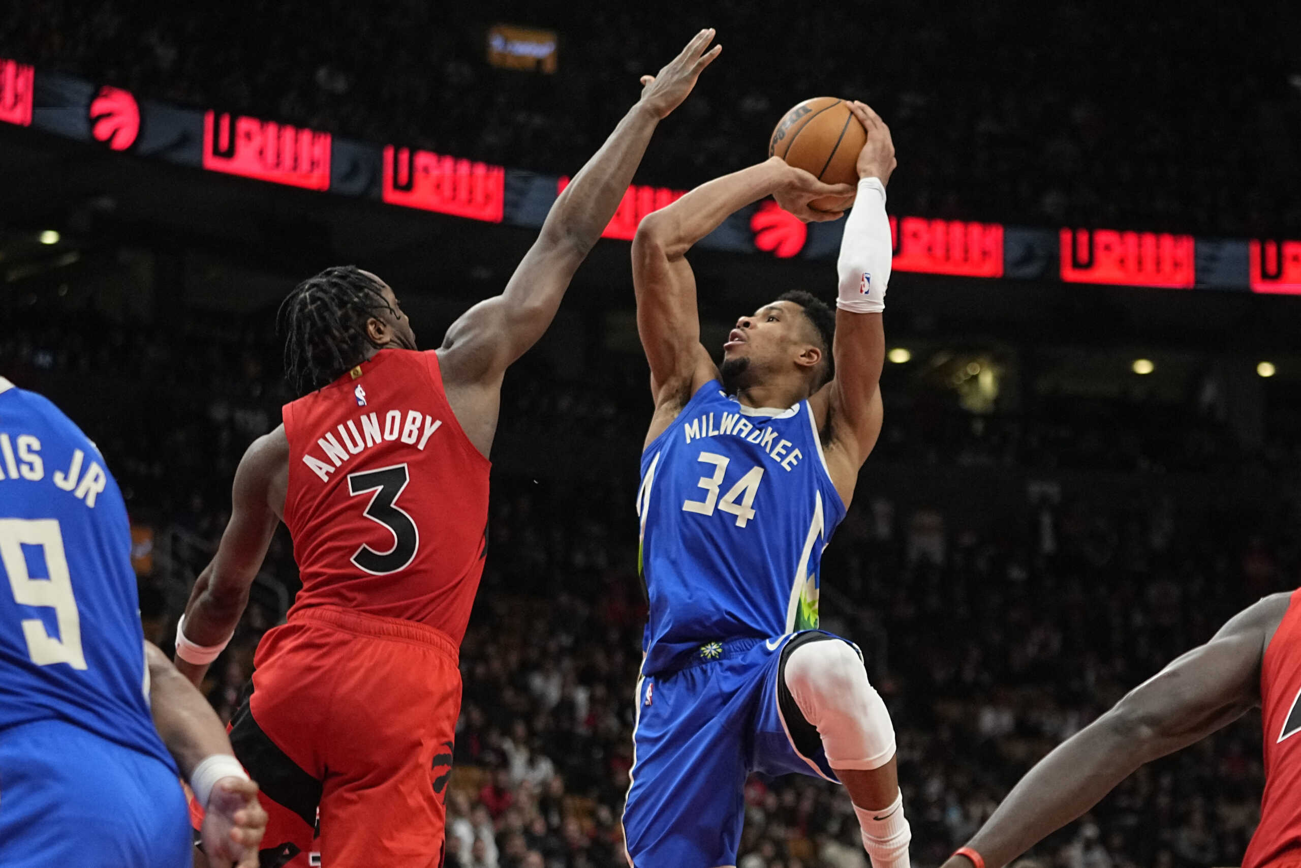 Jan 4, 2023; Toronto, Ontario, CAN; Milwaukee Bucks forward Giannis Antetokounmpo (34) goes to shoot a basket a sToronto Raptors forward O.G. Anunoby (3) defends during overtime at Scotiabank Arena. Mandatory Credit: John E. Sokolowski-USA TODAY Sports
