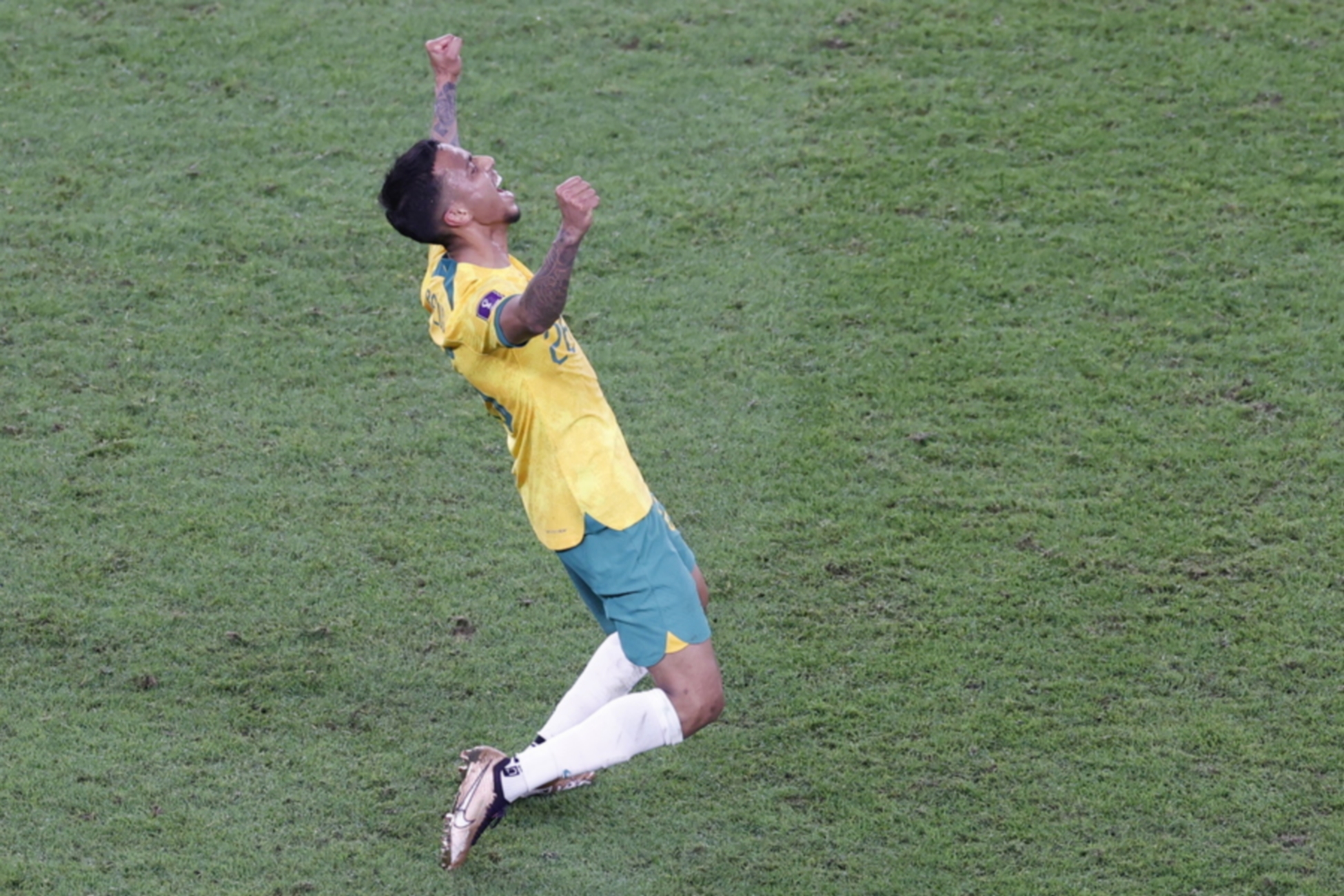 epa10339432 Keanu Baccus of Australia celebrates after the FIFA World Cup 2022 group D soccer match between Australia and Denmark at Al Janoub Stadium in Al Wakrah, Qatar, 30 November 2022.  EPA