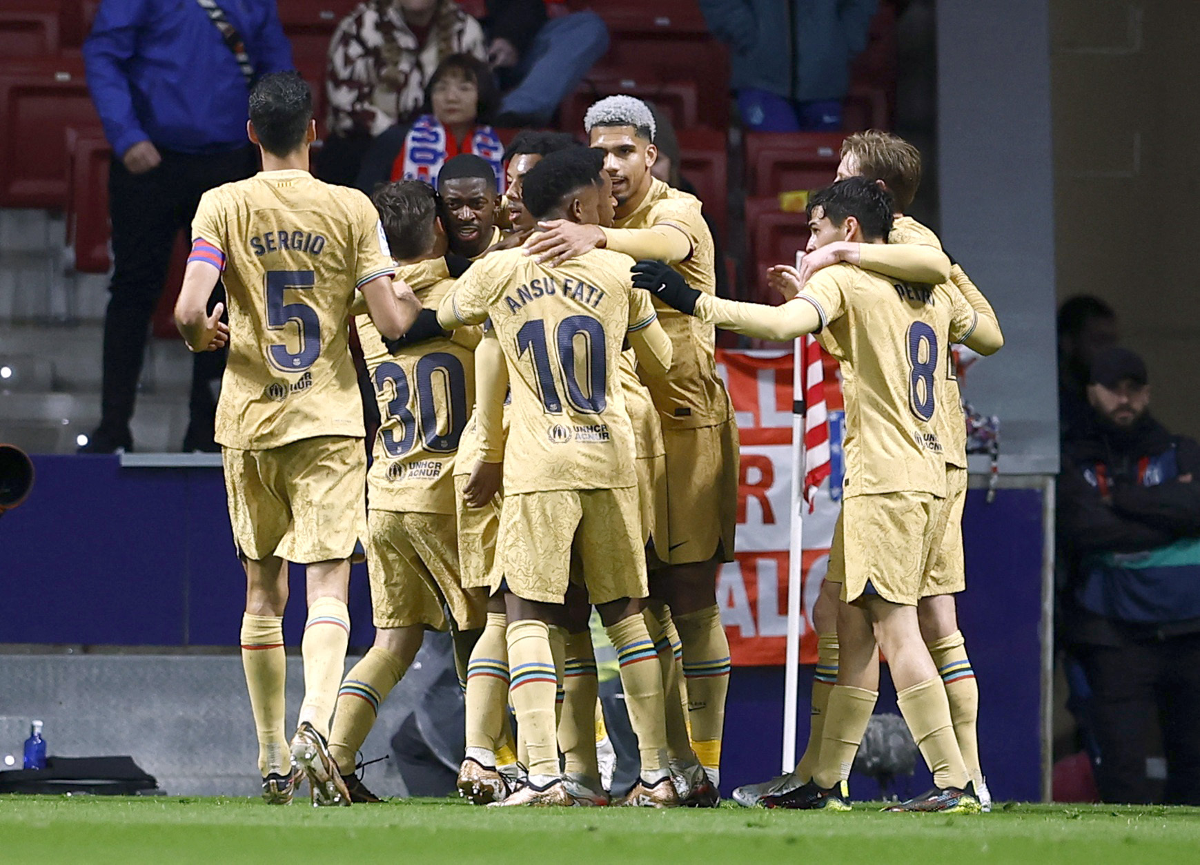 Soccer Football - LaLiga - Atletico Madrid v FC Barcelona - Metropolitano, Madrid, Spain - January 8, 2023 FC Barcelona's Ousmane Dembele celebrates scoring their first goal with Gavi and teammates REUTERS