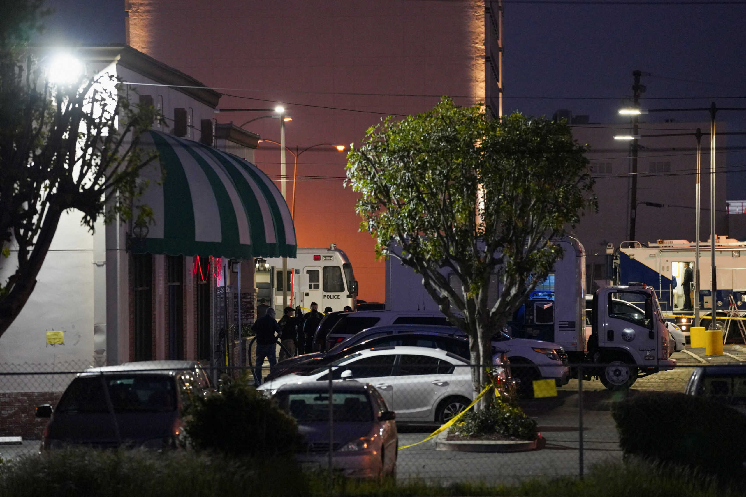 A crime scene clean up crew enters the scene of a shooting that took place at Star Dance Studio during a Chinese Lunar New Year celebration, in Monterey Park, California, U.S. January 22, 2023.  REUTERS