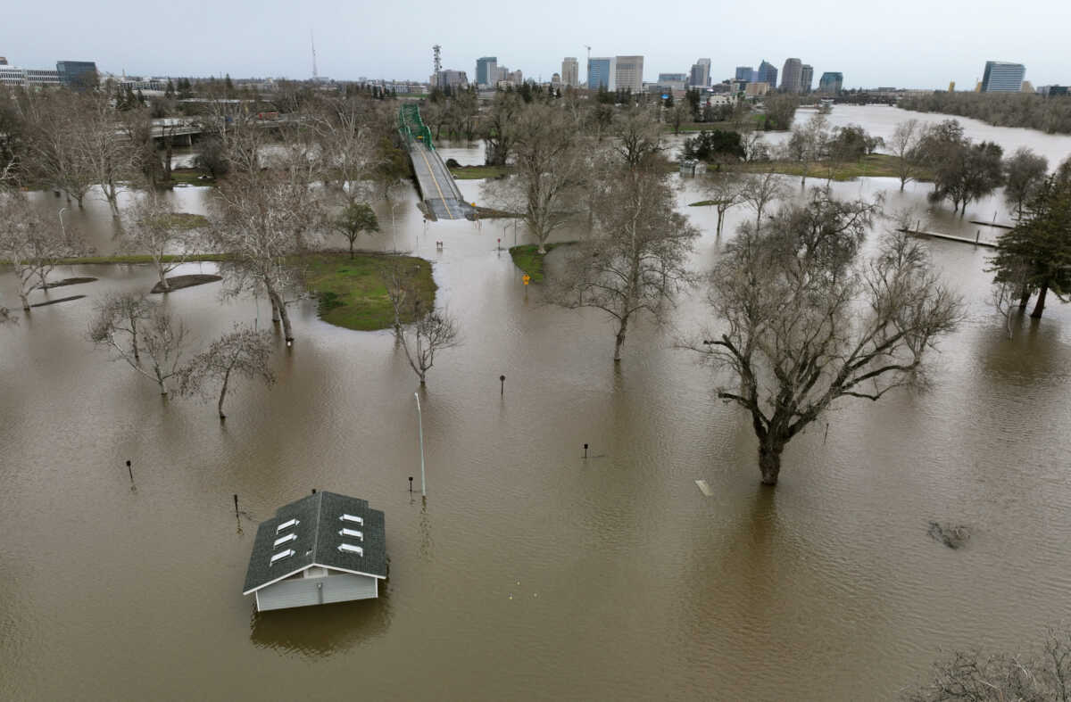 View of flooding from the rainstorm-swollen Sacramento and American Rivers, near downtown Sacramento, California, U.S. January 11, 2023.  REUTERS
