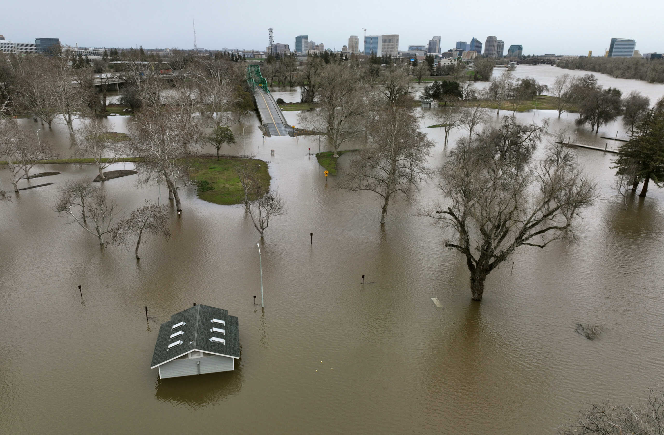 View of flooding from the rainstorm-swollen Sacramento and American Rivers, near downtown Sacramento, California, U.S. January 11, 2023.  REUTERS