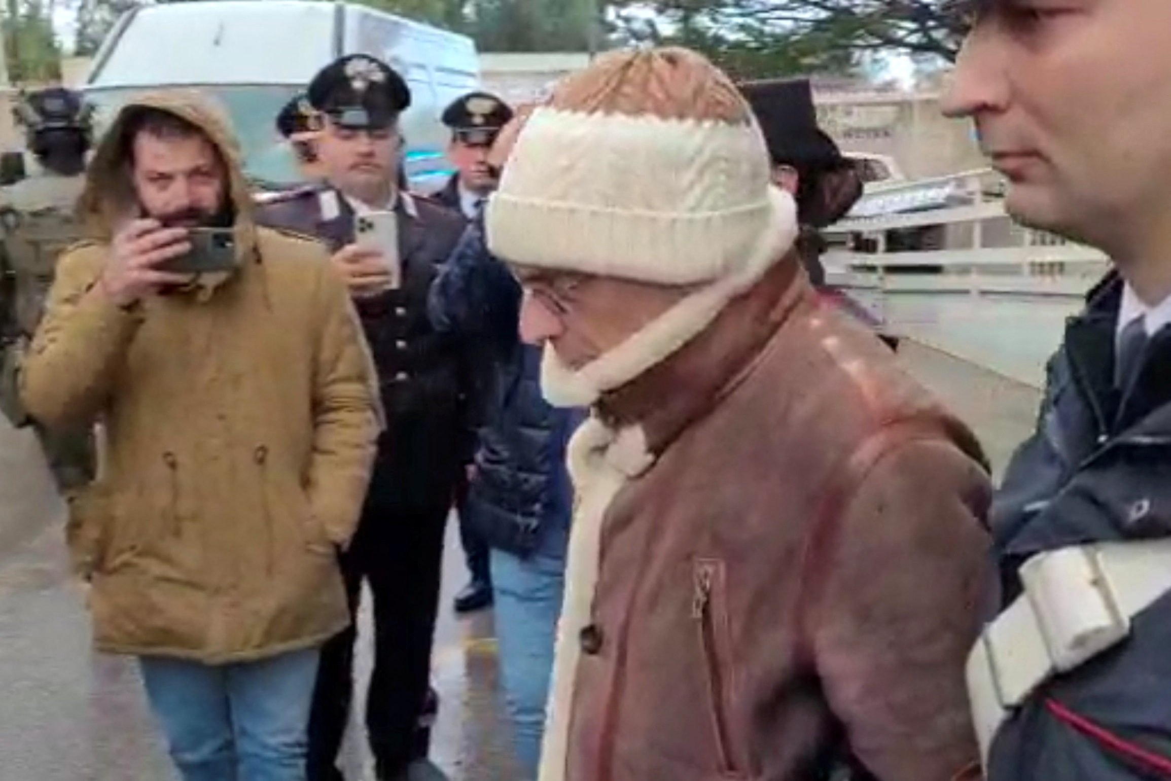 A screengrab taken from a video shows Matteo Messina Denaro the country's most wanted mafia boss being escorted out of a Carabinieri police station after he was arrested in Palermo, Italy, January 16, 2023. Carabinieri