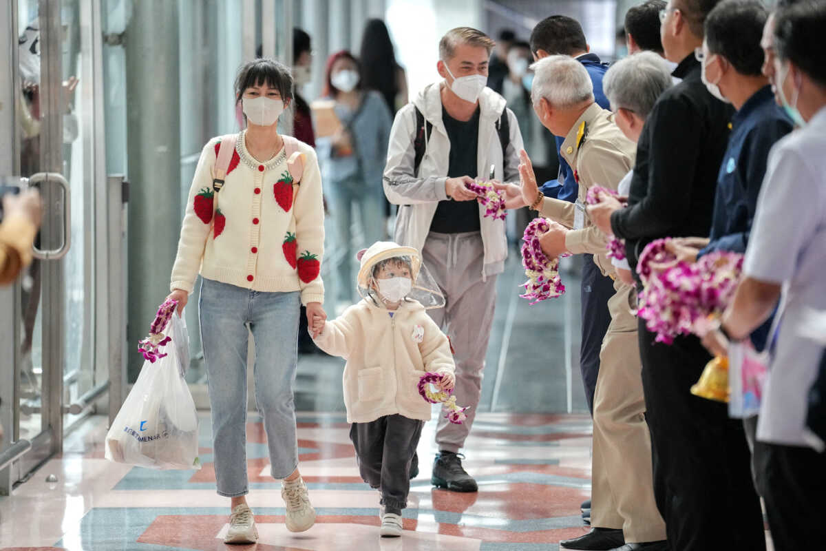 FILE PHOTO: Passengers from China's Xiamen arrive at Bangkok?s Suvarnabhumi airport after China reopens its borders amid the coronavirus (COVID-19) pandemic, in Bangkok, Thailand, January 9, 2023. REUTERS