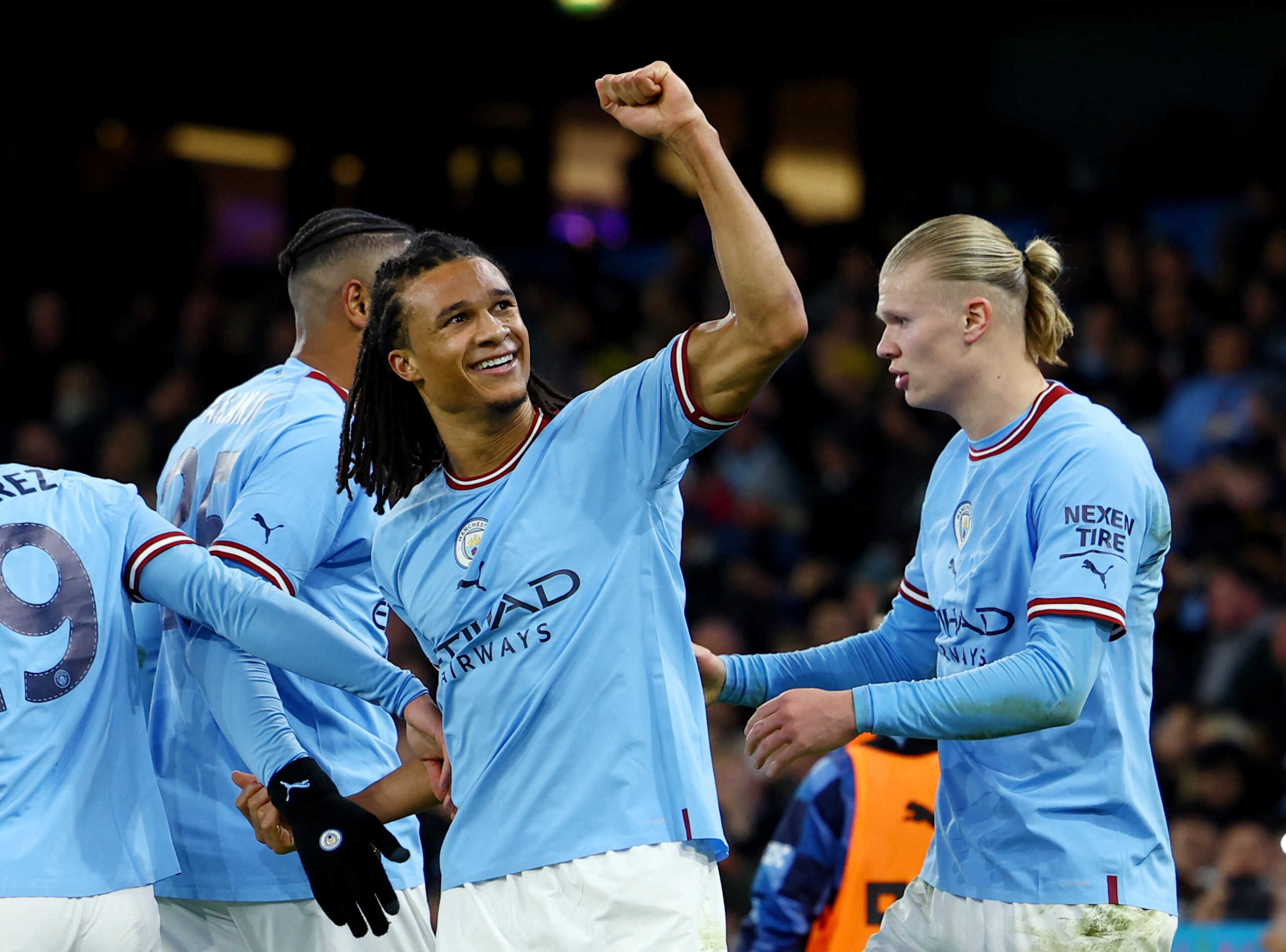 Soccer Football - FA Cup - Fourth Round - Manchester City v Arsenal - Etihad Stadium, Manchester, Britain - January 27, 2023 Manchester City's Nathan Ake celebrates scoring their first goal with teammates REUTERS