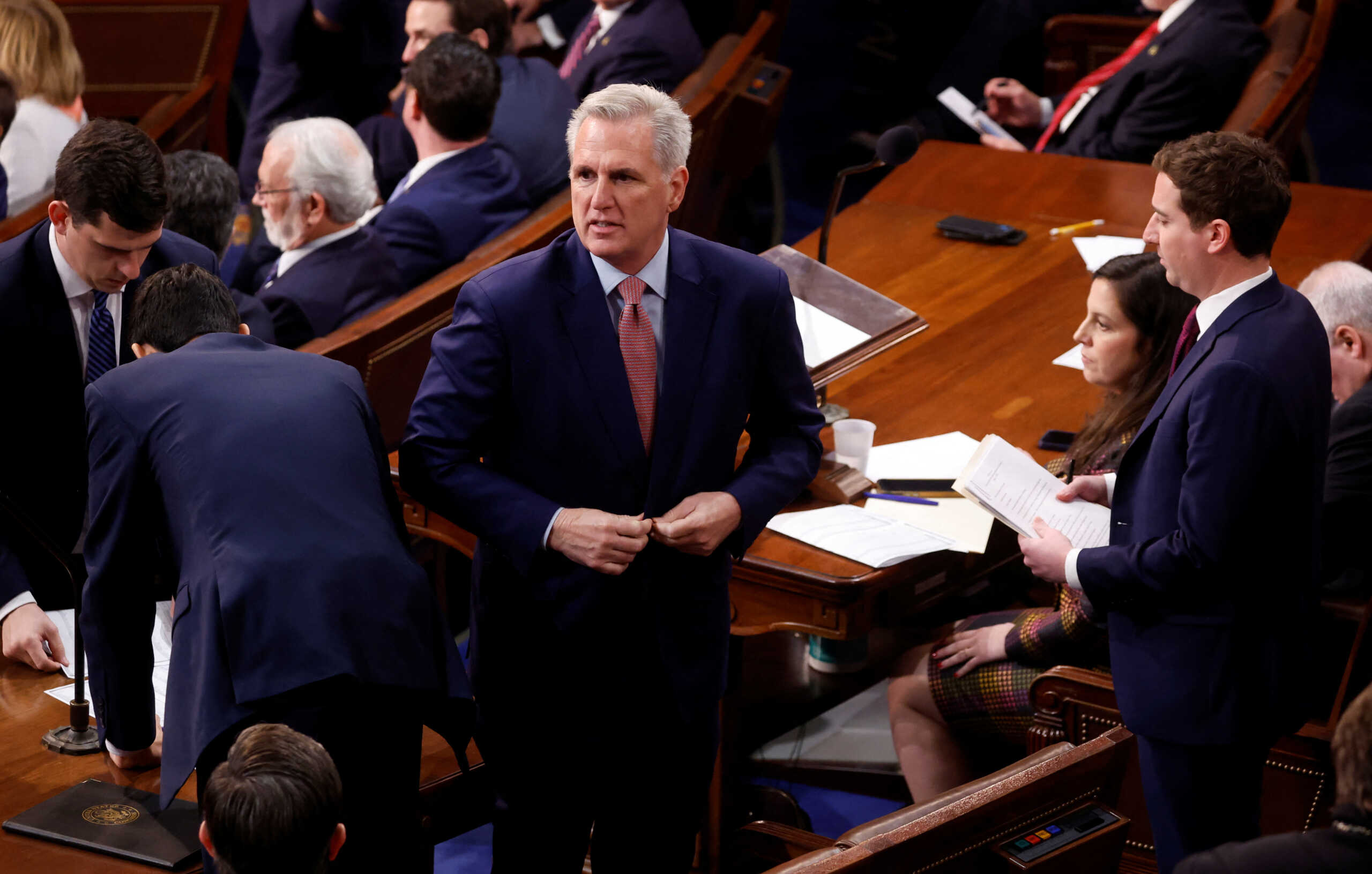 U.S. House Republican leader Kevin McCarthy (R-CA) buttons his jacket and looks around the House Chamber after failing to get enough votes in the first round of voting for the next Speaker of the House in the House Chamber on the first day of the 118th Congress at the U.S. Capitol in Washington, U.S., January 3, 2023. REUTERS