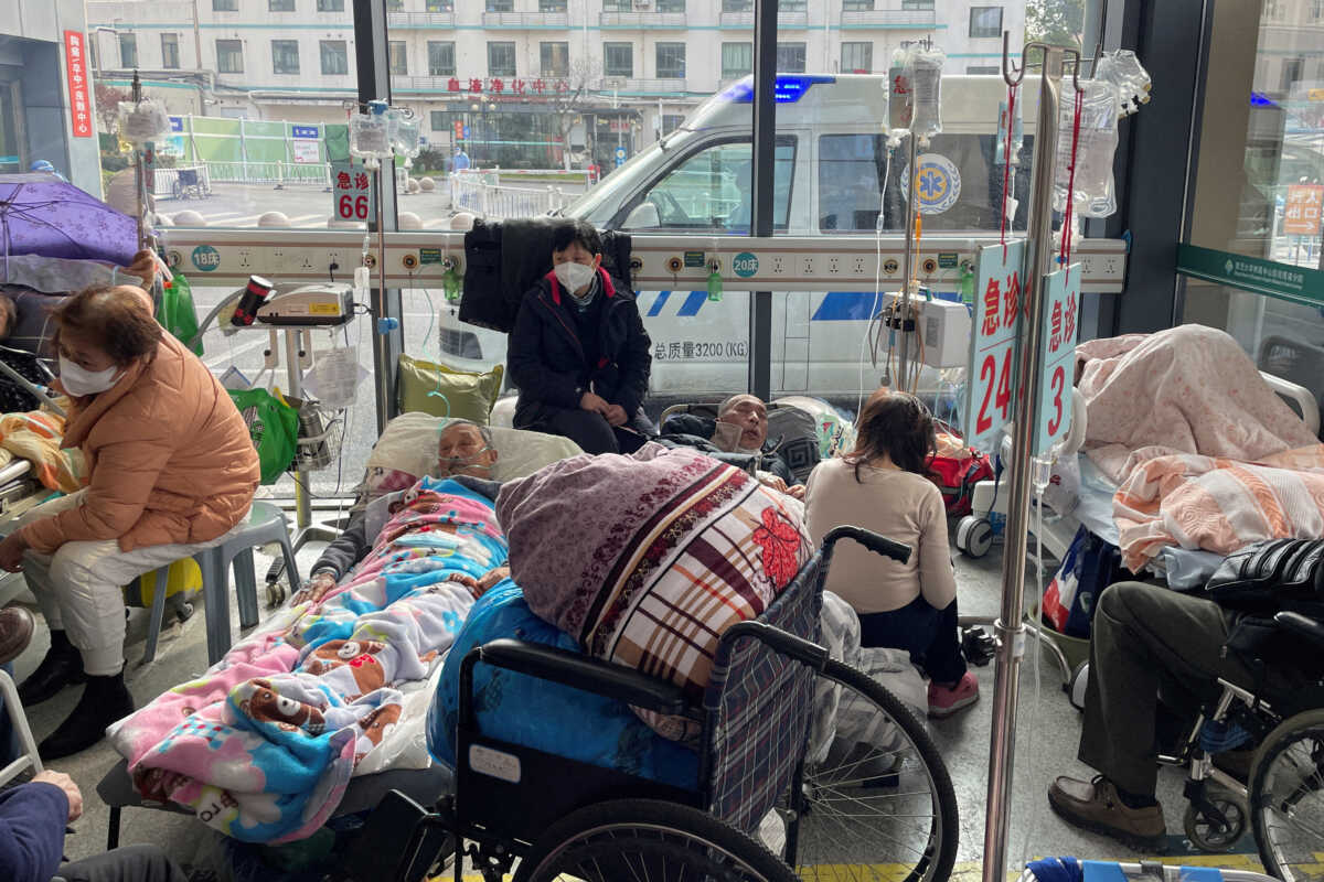 FILE PHOTO: Patients lie on beds in the emergency department of a hospital, amid the coronavirus disease (COVID-19) outbreak in Shanghai, China, January 5, 2023. REUTERS