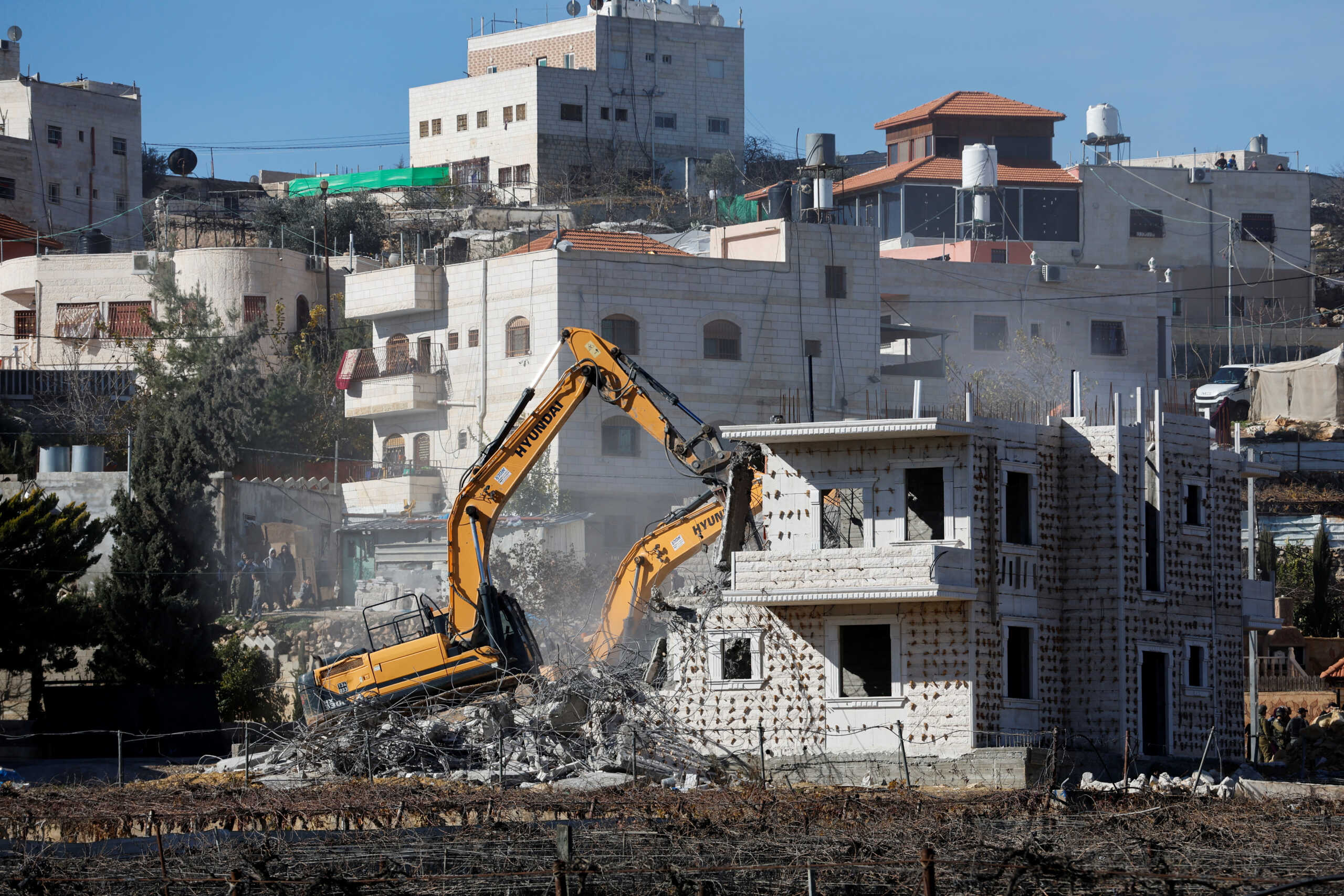Israeli machinery demolish a Palestinian house in Hebron in the occupied West Bank January 11, 2023. REUTERS