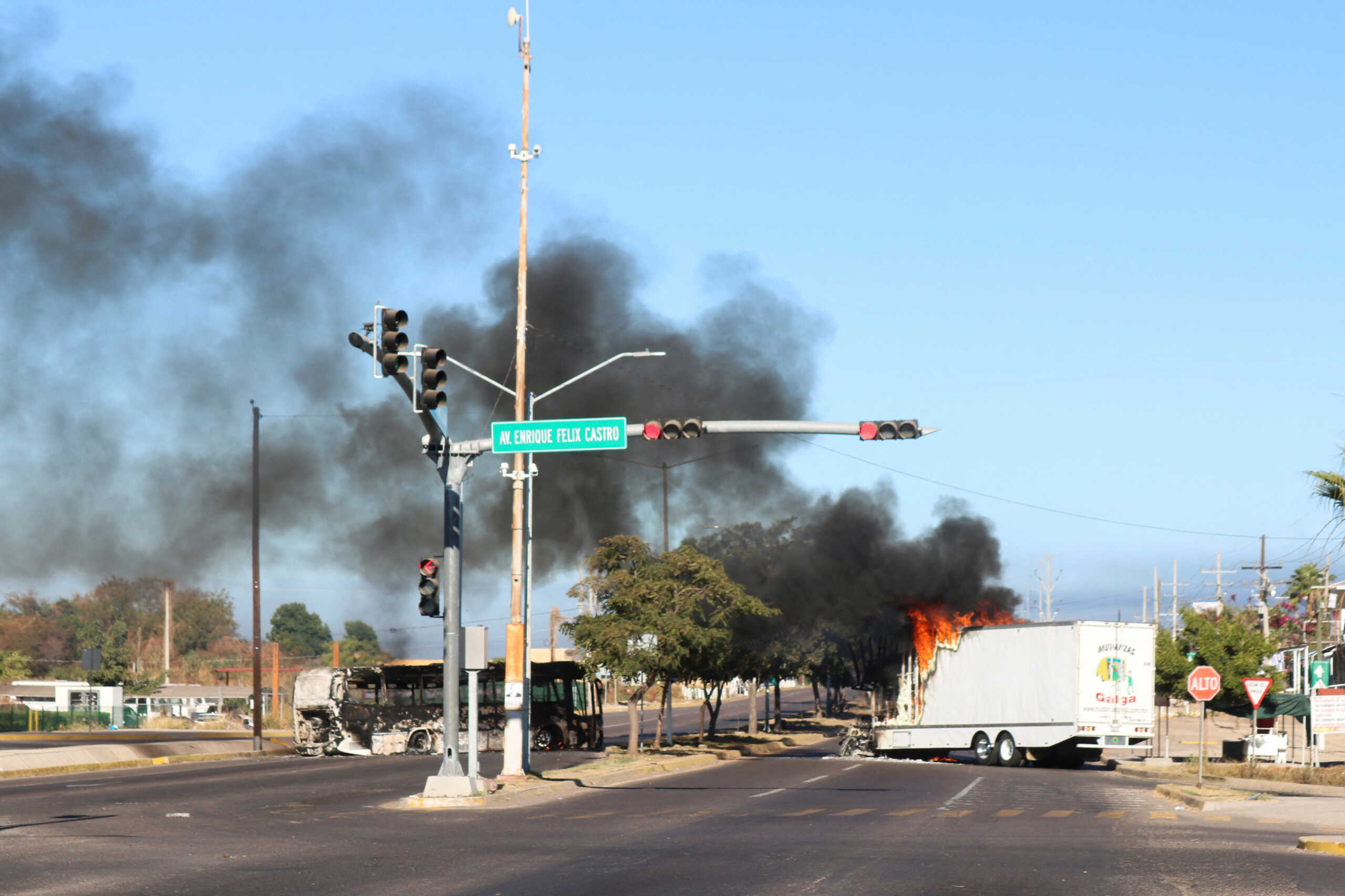 The burnt wreckage of a bus and a truck set on fire by members of a drug gang are pictured following the detention of Mexican drug gang leader Ovidio Guzman, a son of incarcerated kingpin Joaquin "El Chapo" Guzman, who has been arrested by Mexican authorities, in Culiacan, Mexico, January 5, 2023. REUTERS