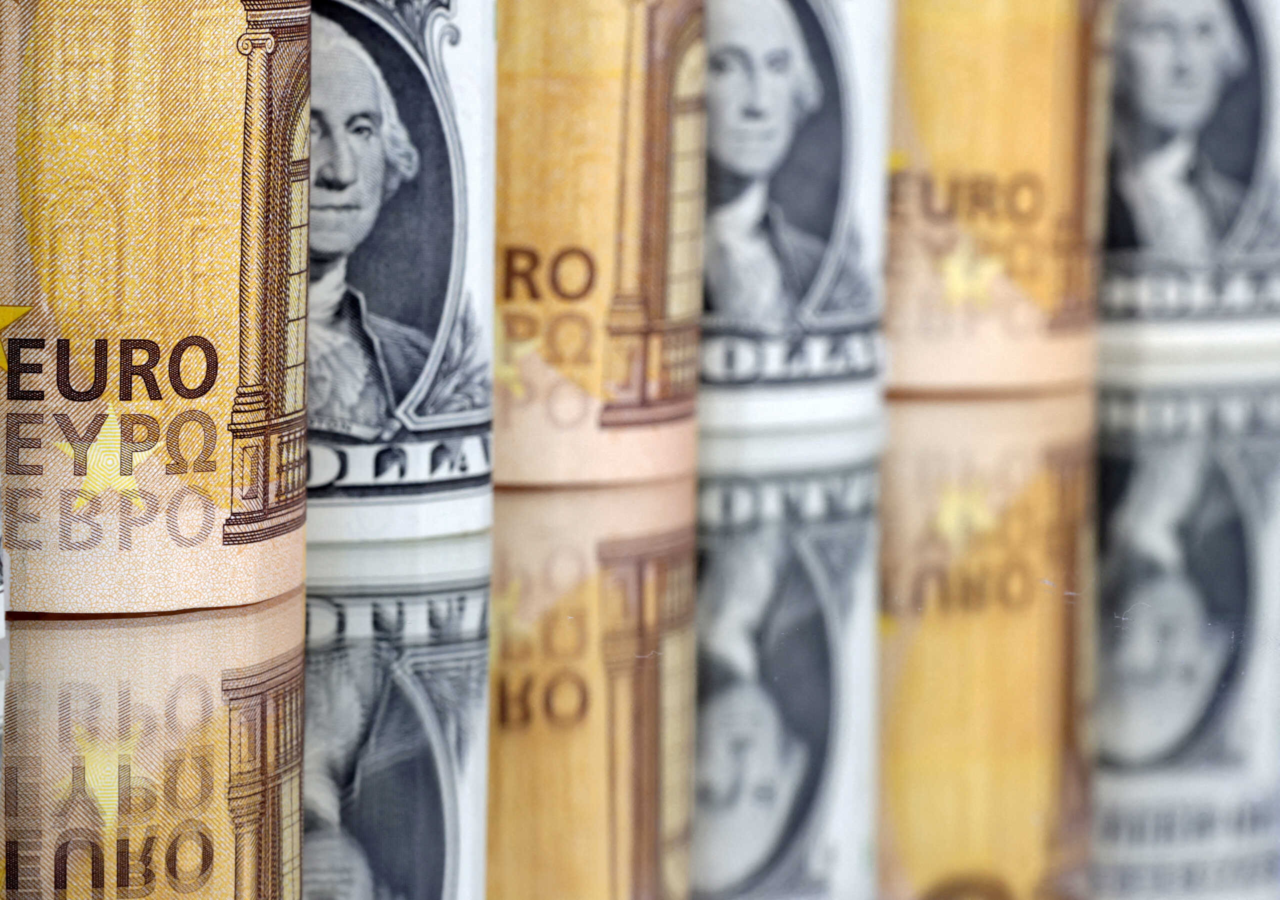 FILE PHOTO: U.S. Dollar and Euro banknotes are seen in this illustration taken July 17, 2022. REUTERS
