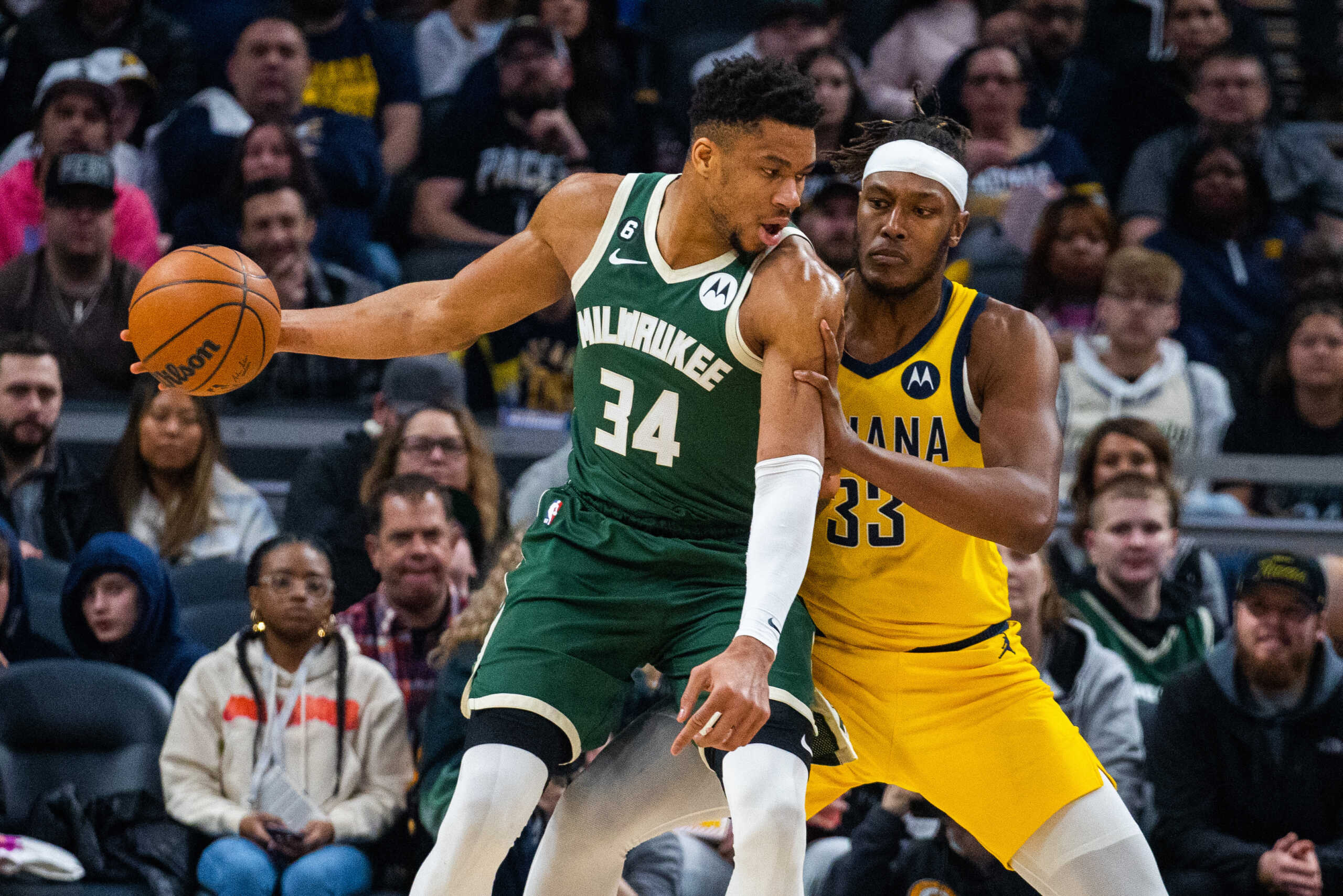 Jan 27, 2023; Indianapolis, Indiana, USA; Milwaukee Bucks forward Giannis Antetokounmpo (34) dribbles the ball while Indiana Pacers center Myles Turner (33) defends in the first quarter at Gainbridge Fieldhouse. Mandatory Credit: Trevor Ruszkowski-USA TODAY Sports