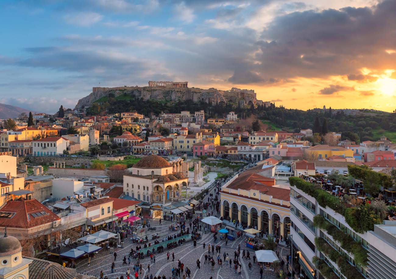 Athens Old town, Greece, with Acropolis and Parthenon Temple during sunset
