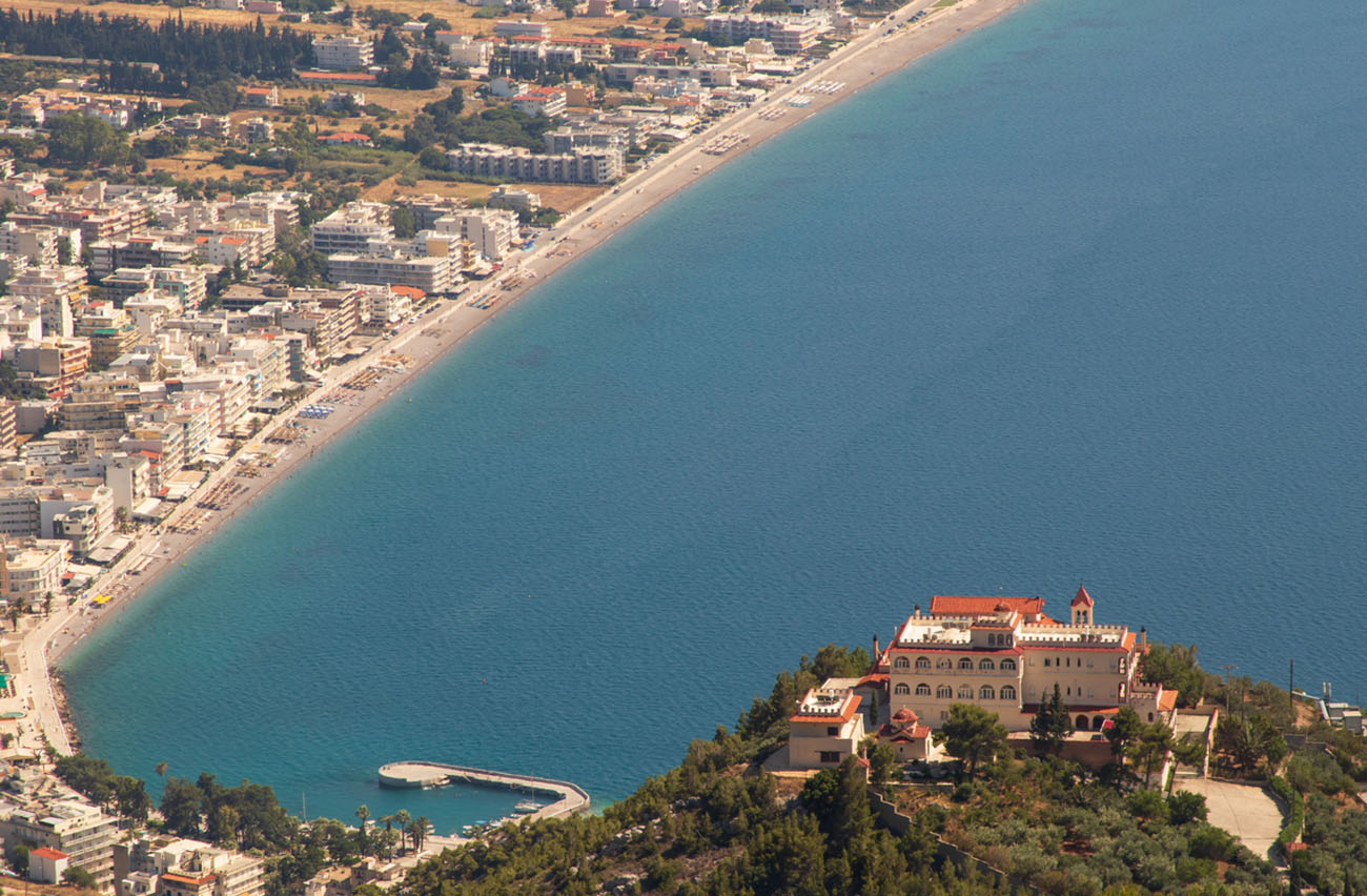 Landscape, panoramic view of the sea town, coastal part, and beautiful monastery on the mountain