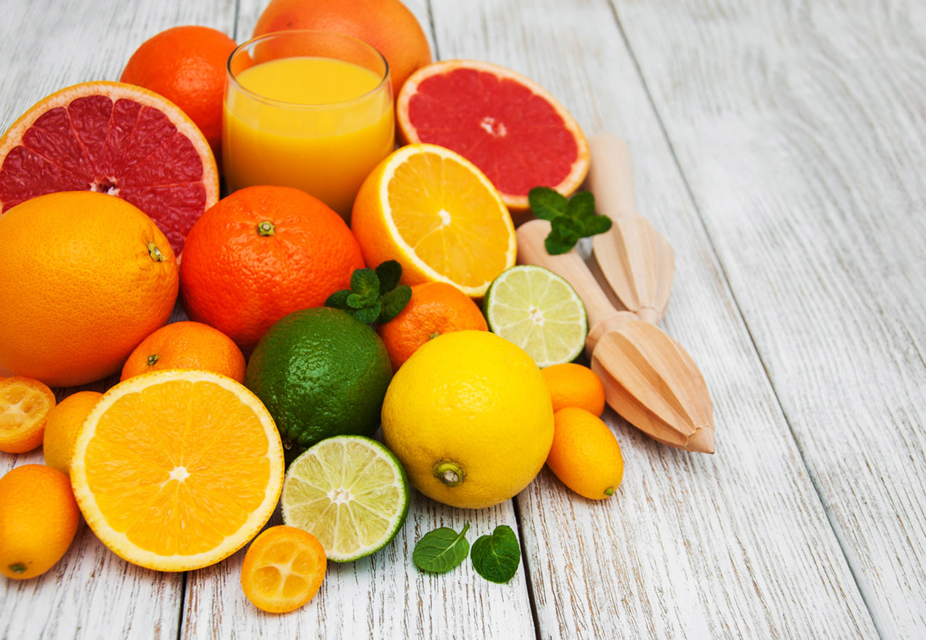 Fresh citrus fruits on a old wooden table