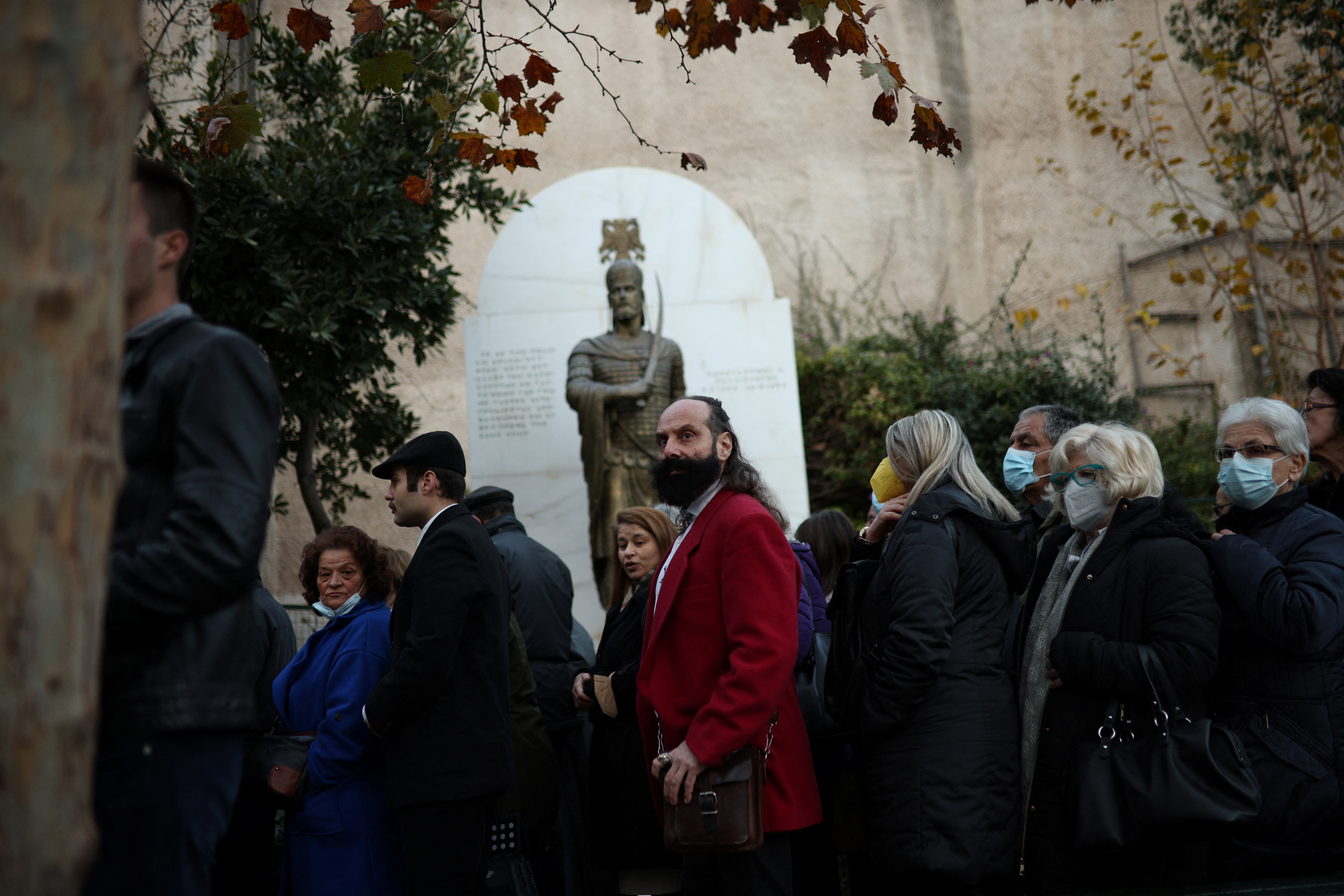 People wait to pay their respects to former King of Greece Constantine II in Saint Eleftherios chapel, where he lies at rest before the funeral service, in Athens, Greece, January 16, 2023. REUTERS