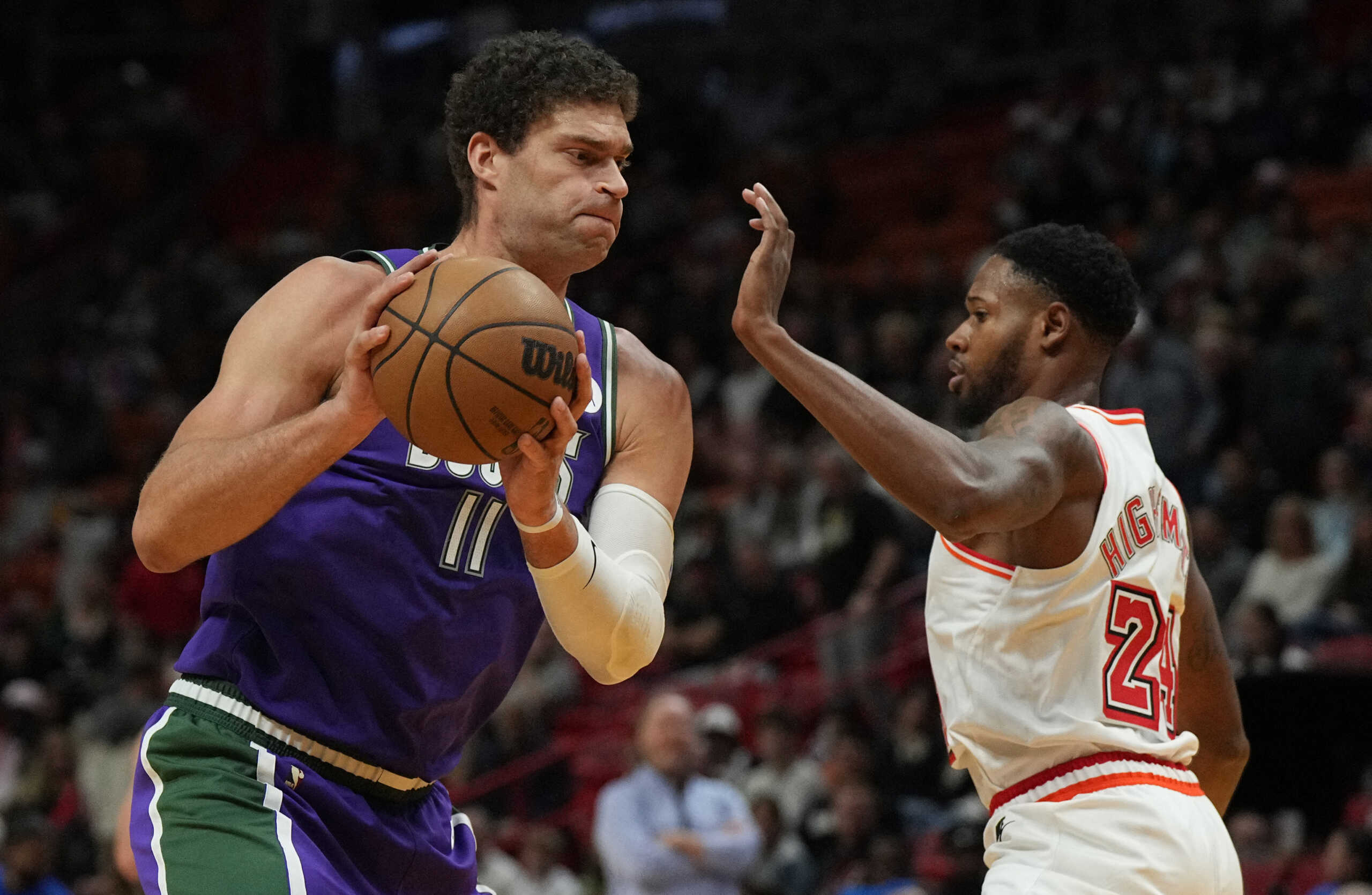 Jan 14, 2023; Miami, Florida, USA; Milwaukee Bucks center Brook Lopez (11) controls the ball against Miami Heat forward Haywood Highsmith (24) during the first half at Miami-Dade Arena. Mandatory Credit: Jim Rassol-USA TODAY Sports