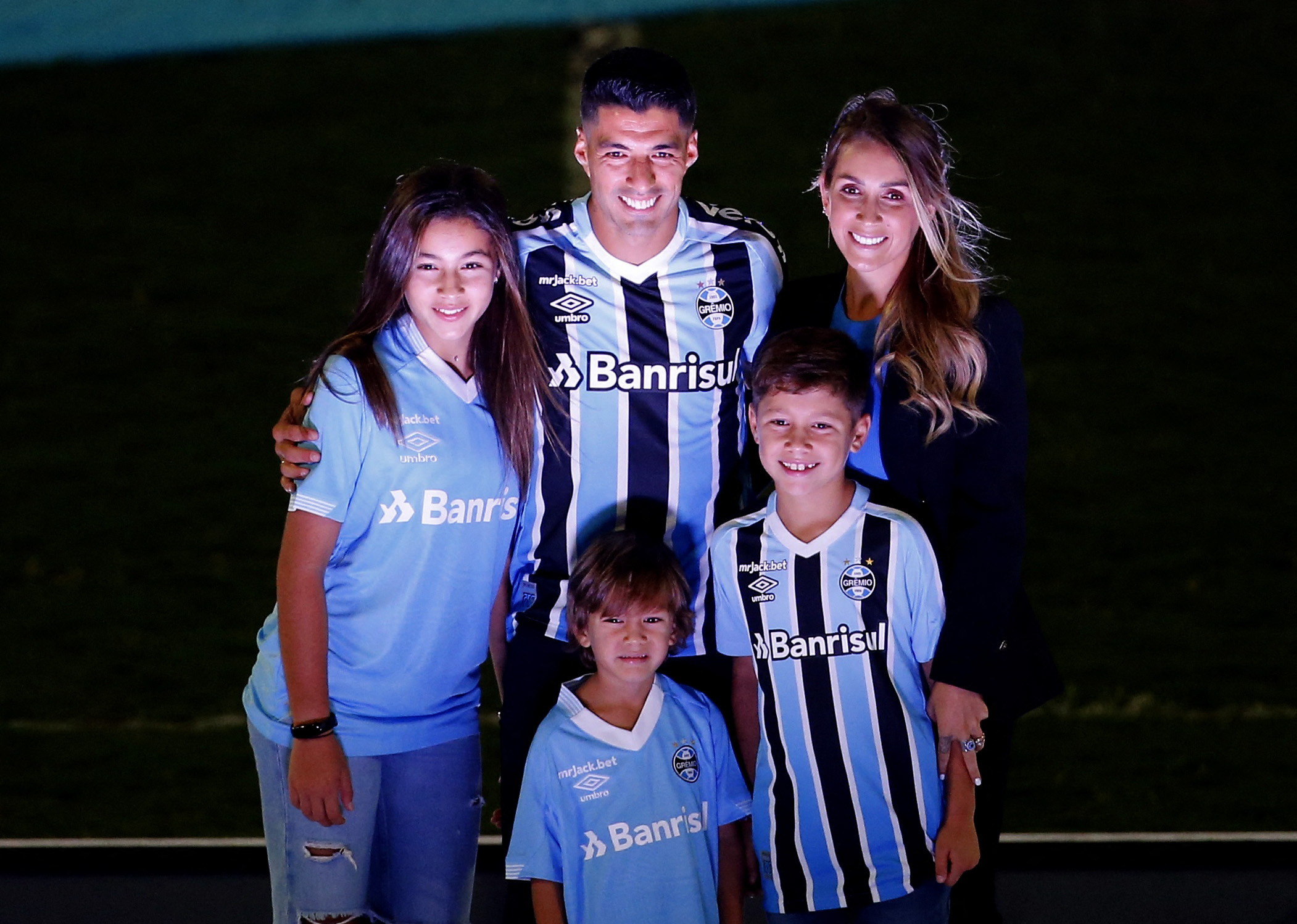 Soccer Football - Gremio present new signing Luis Suarez - Arena do Gremio, Porto Alegre, Brazil - January 4, 2023 Gremio's new signing Luis Suarez with his wife Sofia Balbi and children during the presentation REUTERS