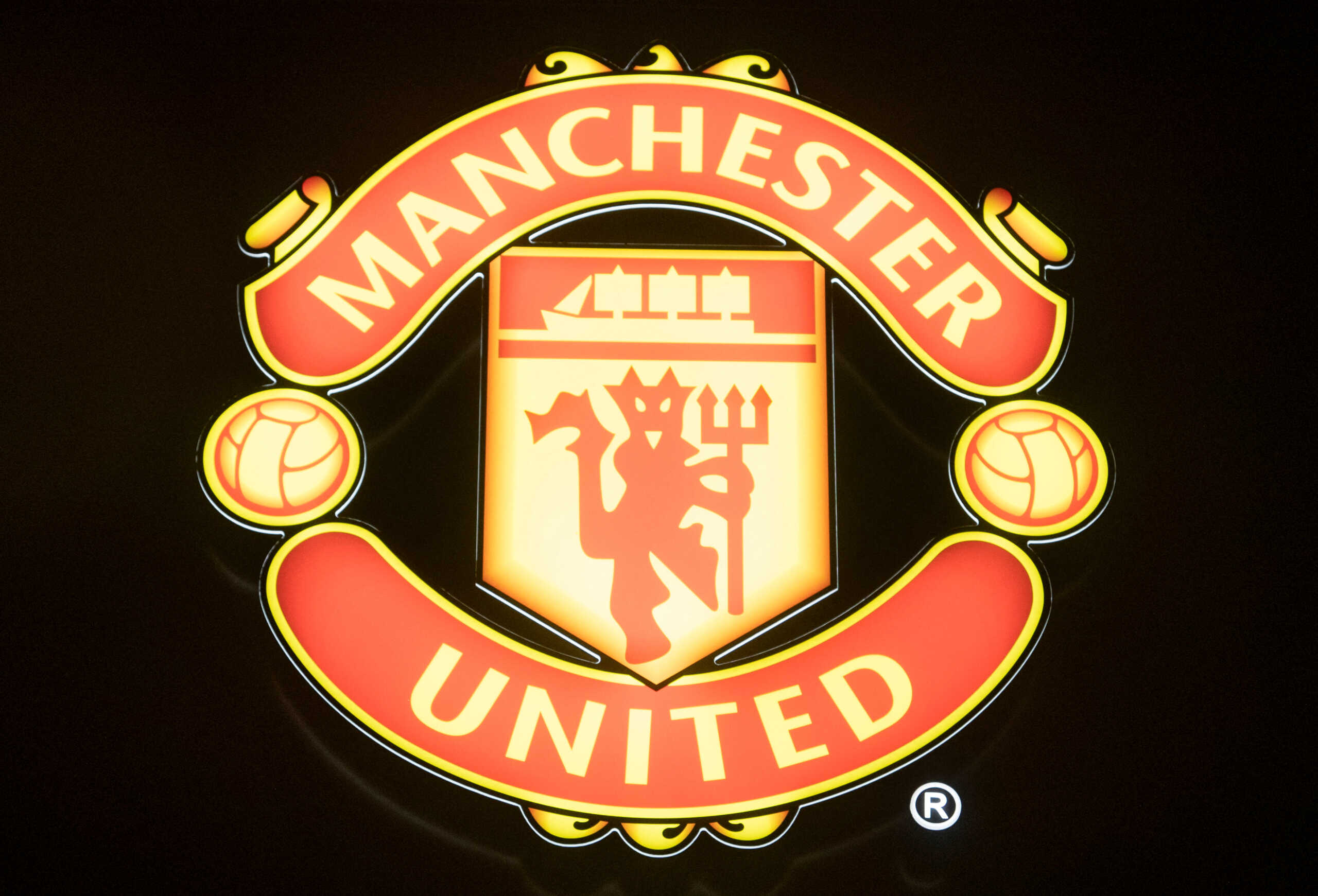 The logo of British soccer club Manchester United is seen at a lounge during the World Economic Forum (WEF) 2023 in the Alpine resort of Davos, Switzerland, January 15, 2023. REUTERS