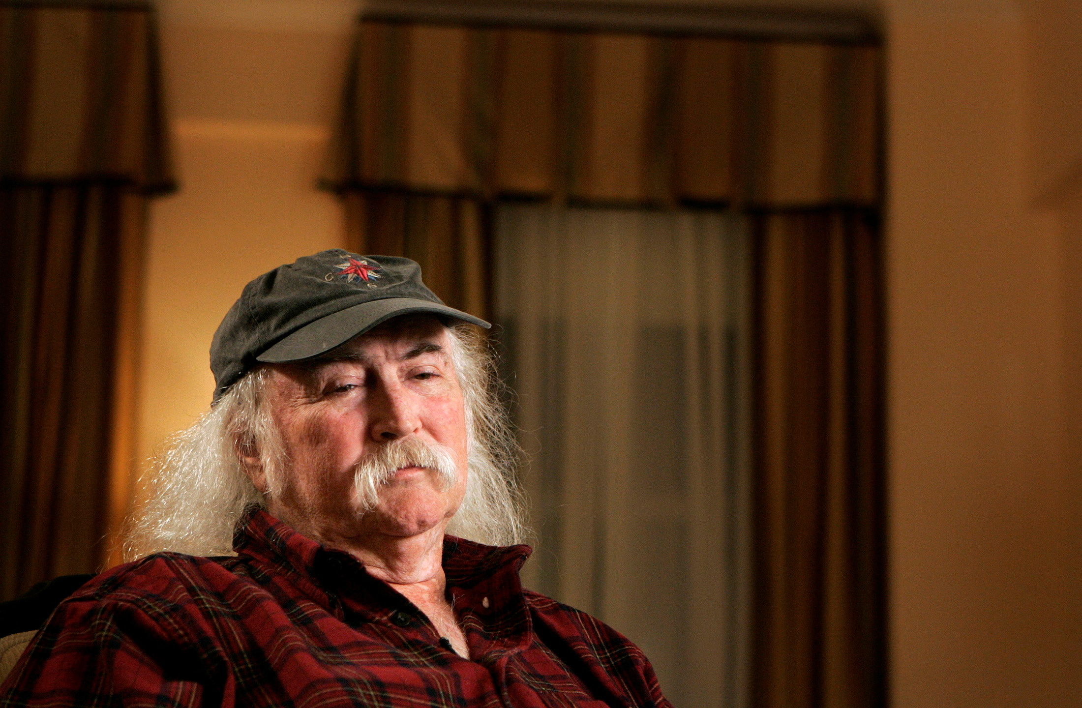 FILE PHOTO: Musician David Crosby poses for a portrait before an interview regarding his new autobiography, in New York, U.S. November 28, 2006. REUTERS