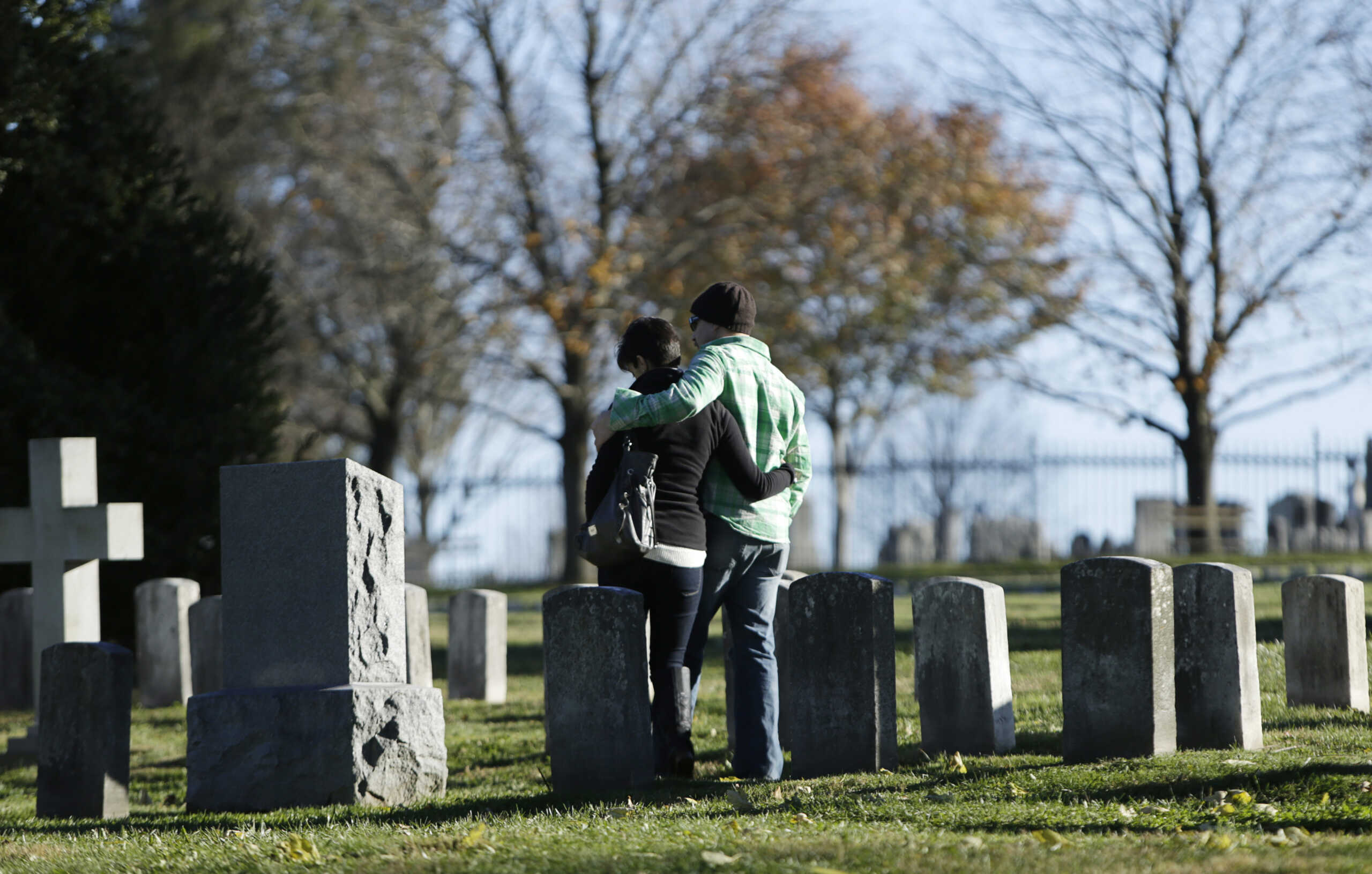 Visitors stand amongst graves at the Gettysburg National Cemetery in Pennsylvania November 18, 2013. REUTERS