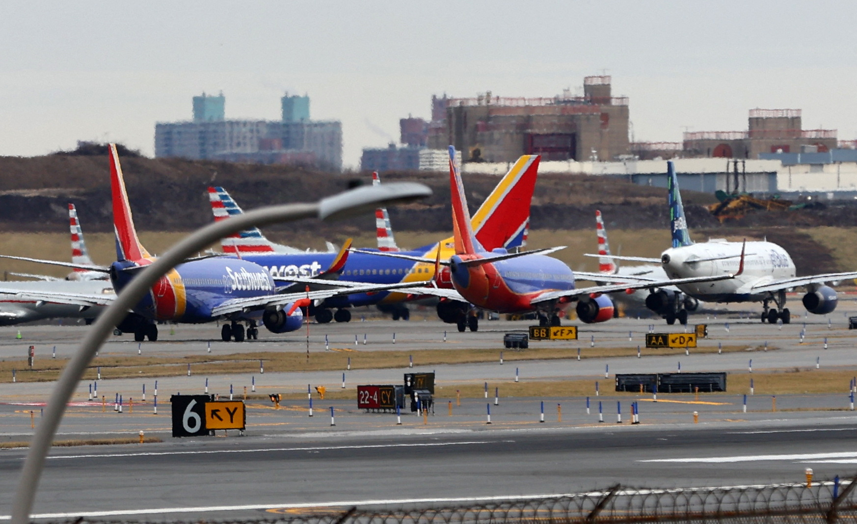 Commercial airplanes are pictured backed up waiting to depart on the runway after flights earlier were grounded during an FAA system outage at Laguardia Airport in New York City, New York, U.S., January 11, 2023. REUTERS
