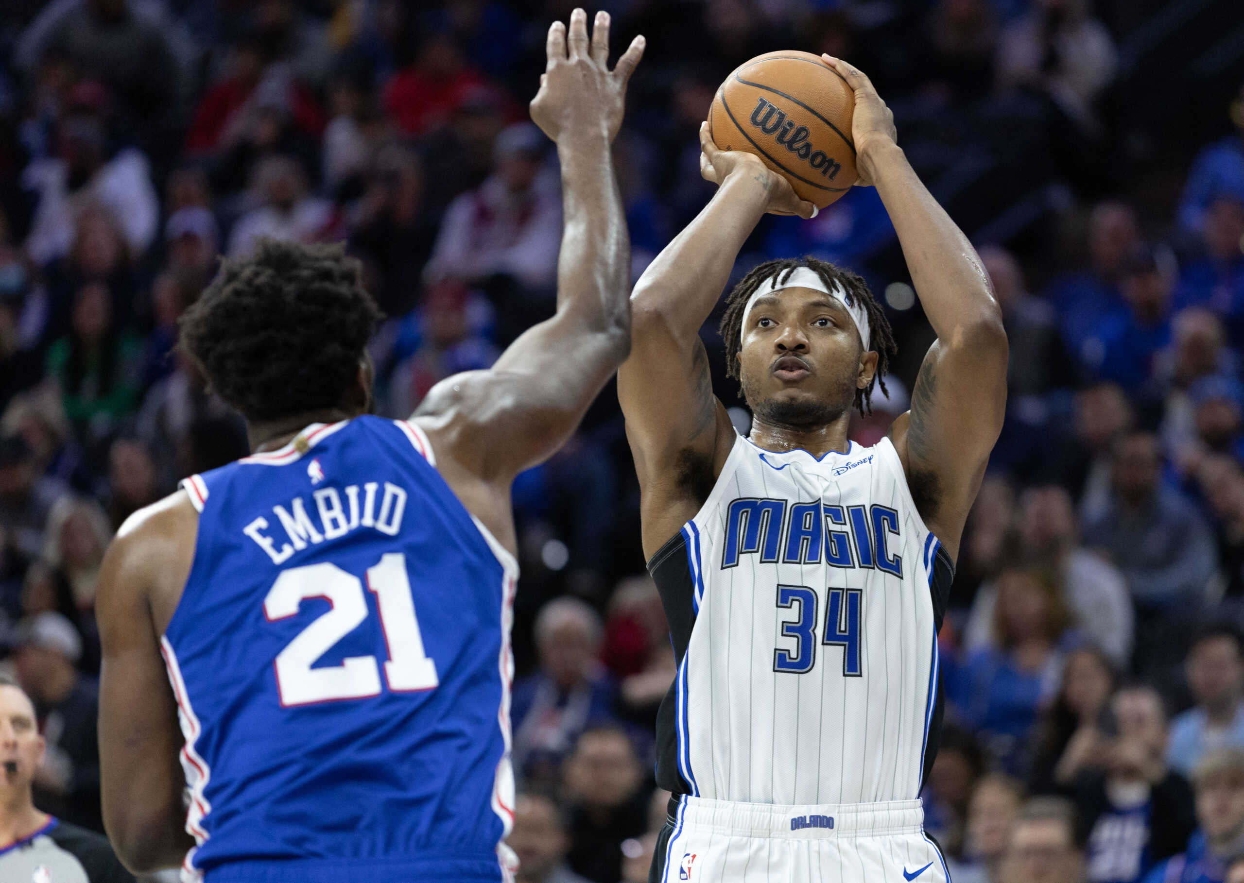 Jan 30, 2023; Philadelphia, Pennsylvania, USA; Orlando Magic center Wendell Carter Jr. (34) shoots the ball in front of Philadelphia 76ers center Joel Embiid (21) during the first quarter at Wells Fargo Center. Mandatory Credit: Bill Streicher-USA TODAY Sports