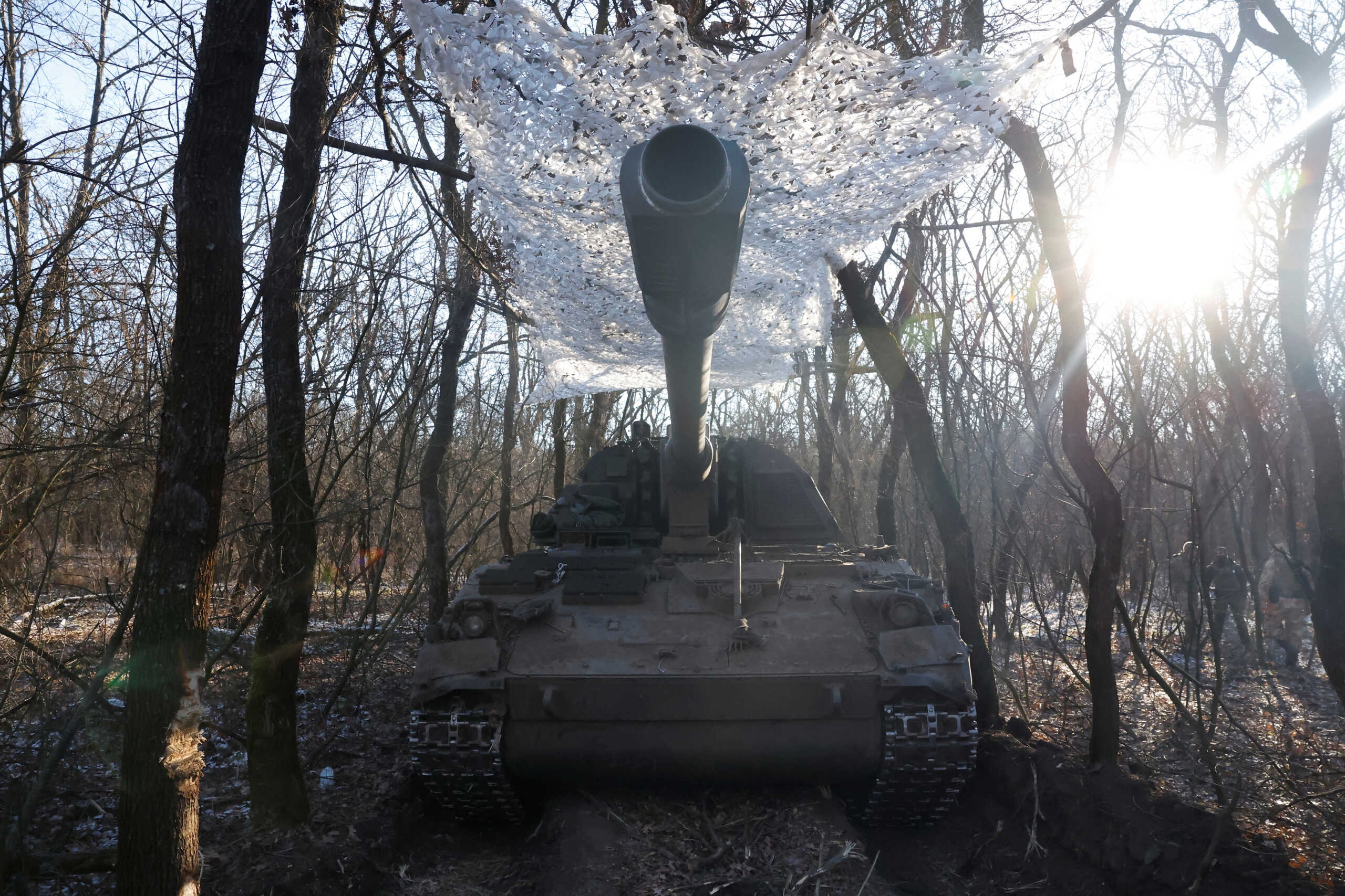 A German howitzer Panzerhaubitze 2000 is disguised by Ukrainian army of the 43rd Heavy Artillery Brigade, as Russia's attack on Ukraine continues, near Soledar, Ukraine, January 11, 2023. REUTERS