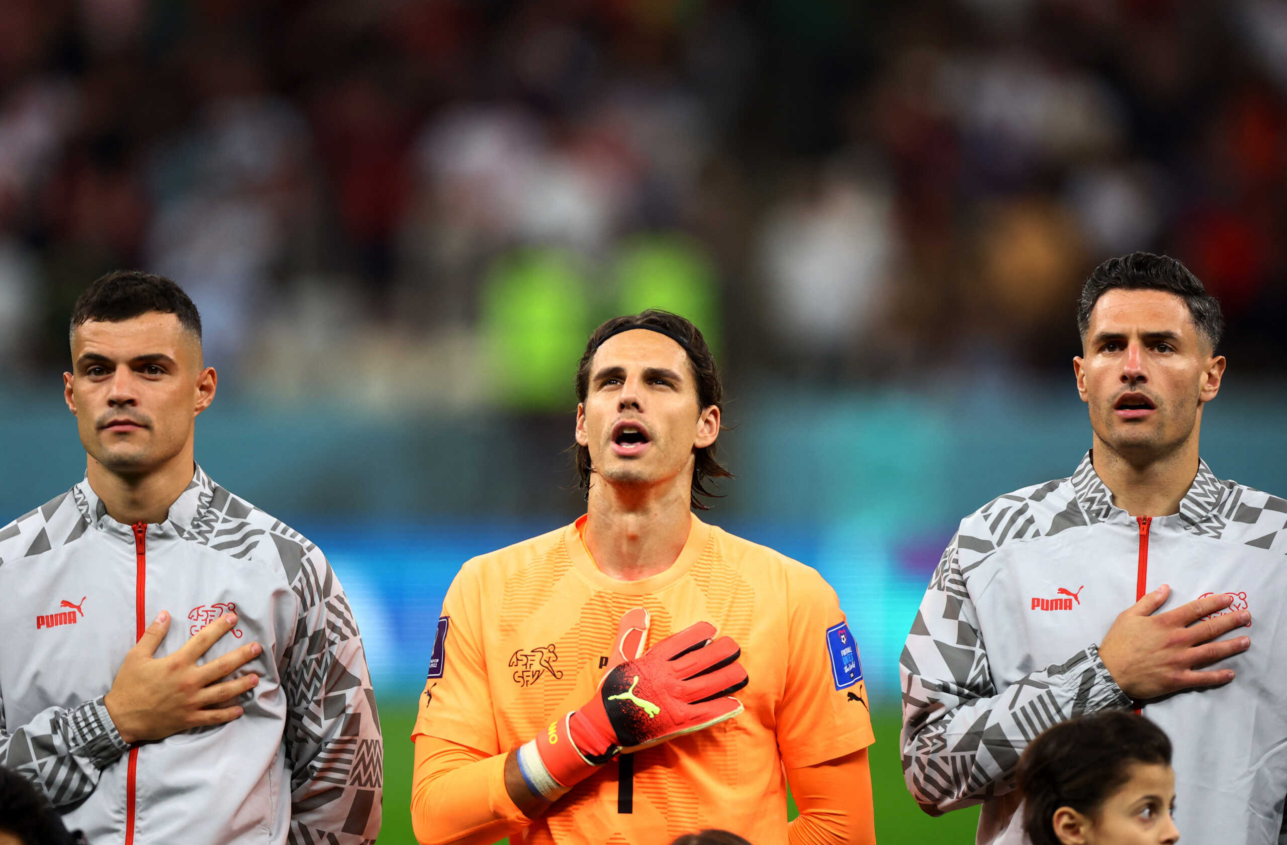 Soccer Football - FIFA World Cup Qatar 2022 - Round of 16 - Portugal v Switzerland - Lusail Stadium, Lusail, Qatar - December 6, 2022  Switzerland's Yann Sommer, Granit Xhaka and Fabian Schaer line up during the national anthems before the match REUTERS
