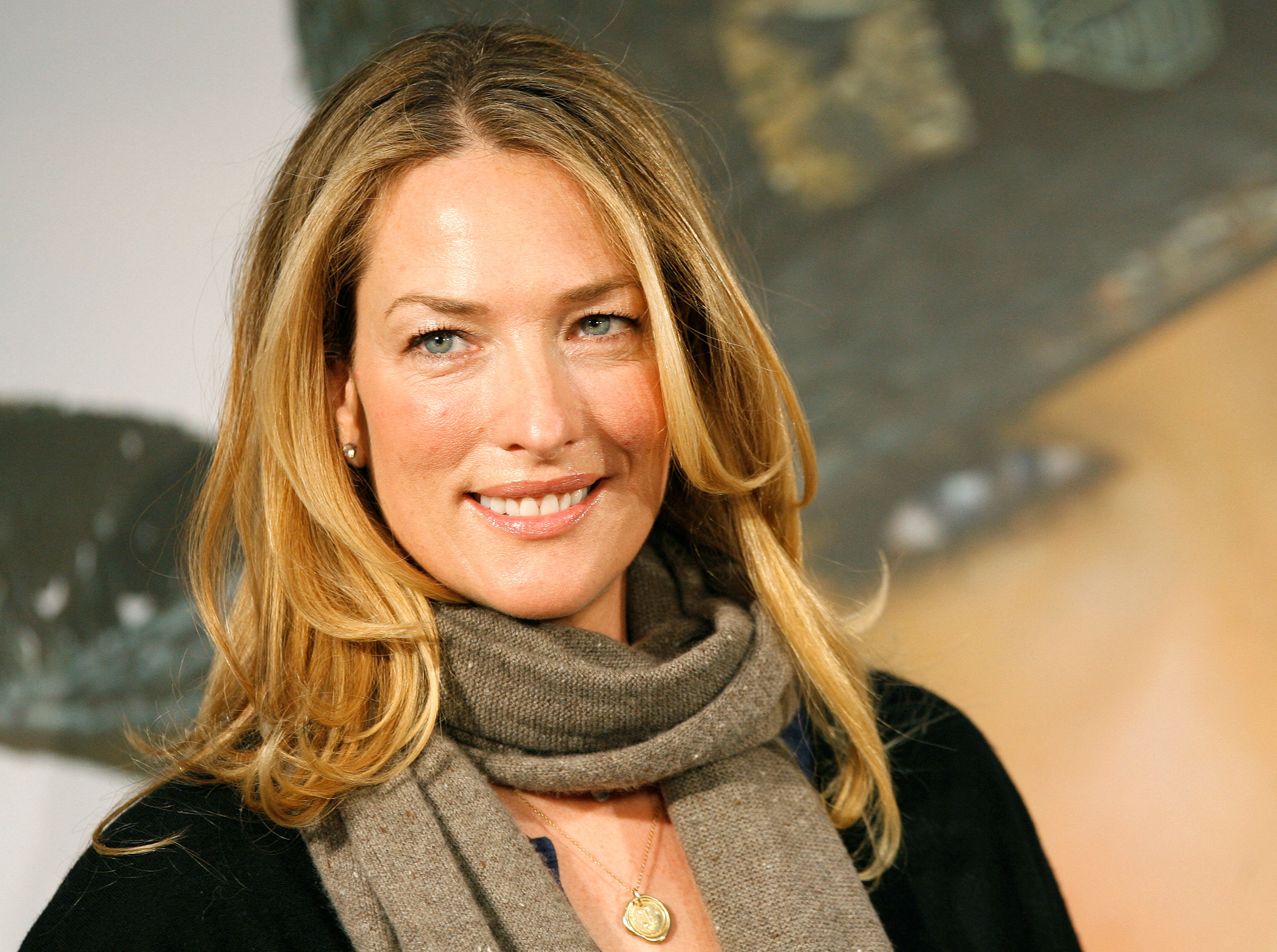 FILE PHOTO: German model Tatjana Patitz smiles as she presents the new catalogue of the OTTO group in Hamburg December 14, 2006. REUTERS