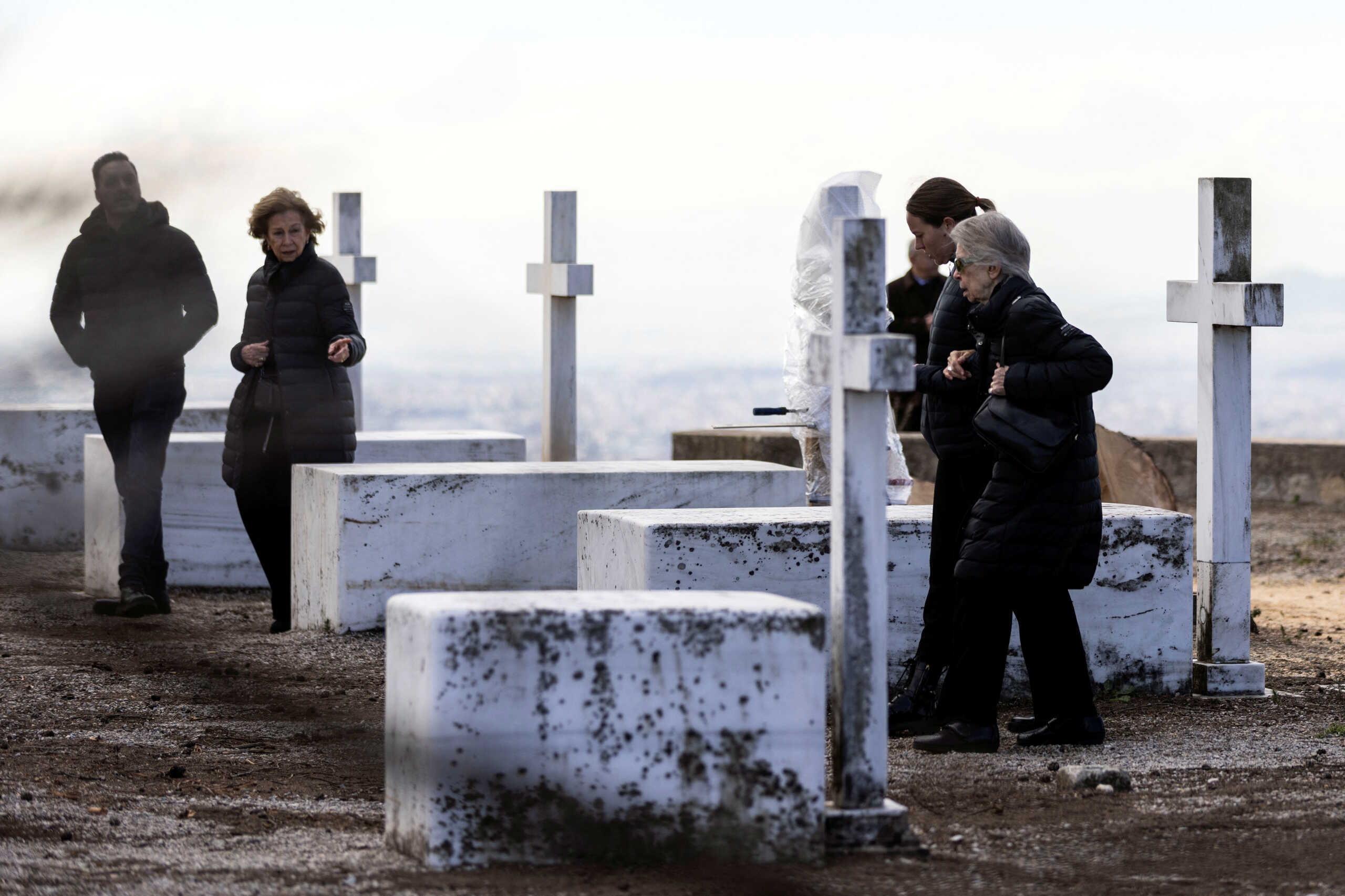 Spain's former queen Sofia and Greece's former princess Irene, sisters of Greece's late former King Constantine II, walk among tombs of members of the former Greek royal family, on the estate of the summer palace where Constantine II will be buried in Athens, Greece, January 12, 2023. REUTERS