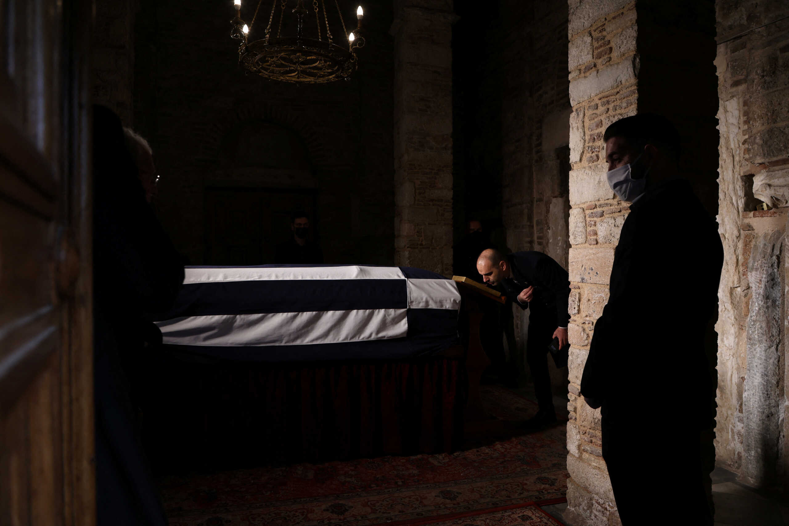 People pay their respects to former King of Greece Constantine II at Saint Eleftherios chapel, where he lies at rest before the funeral service, in Athens, Greece, January 16, 2023. REUTERS