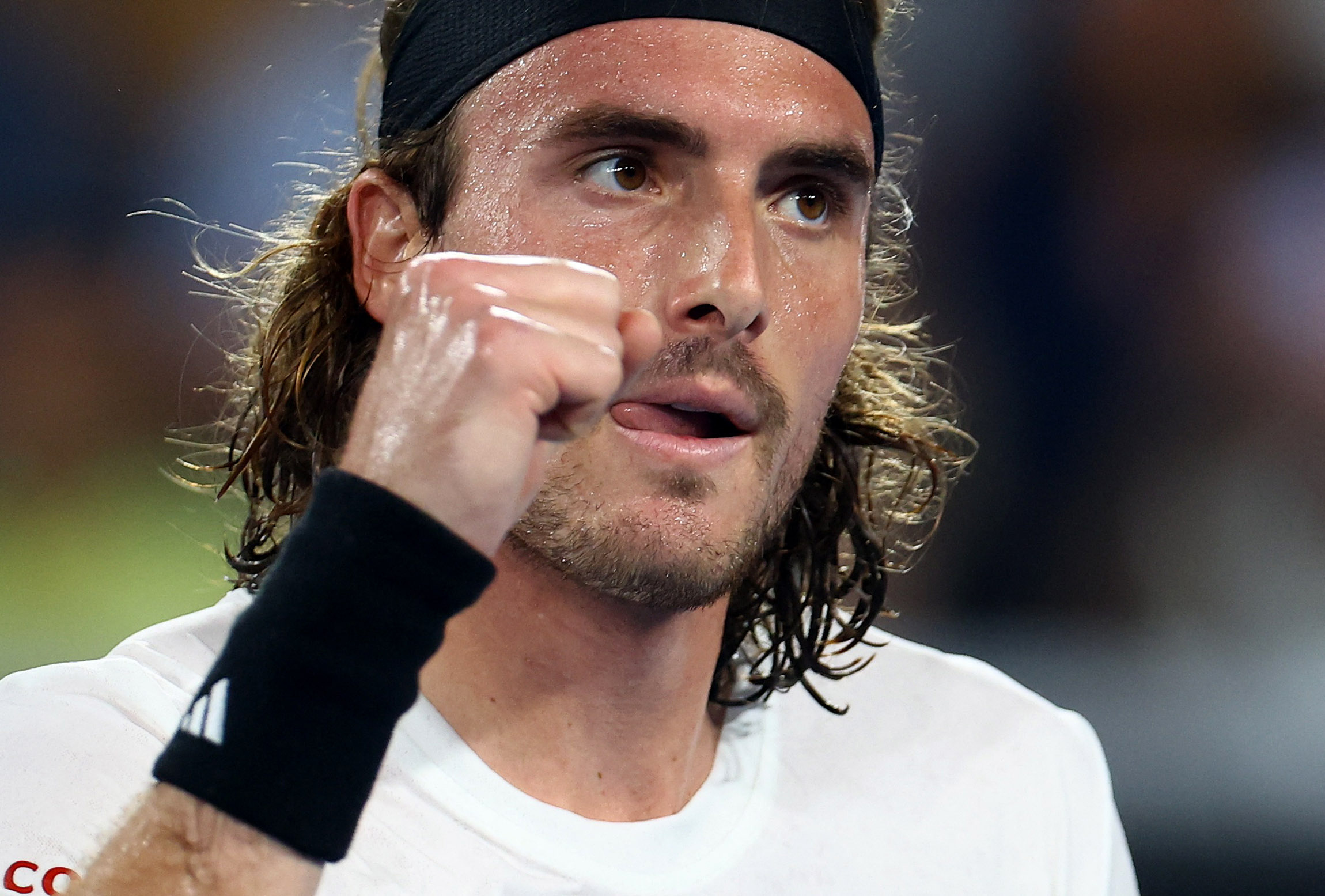 Tennis - Australian Open - Melbourne Park, Melbourne, Australia - January 16, 2023 Greece's Stefanos Tsitsipas reacts during his first round match against France's Quentin Halys REUTERS