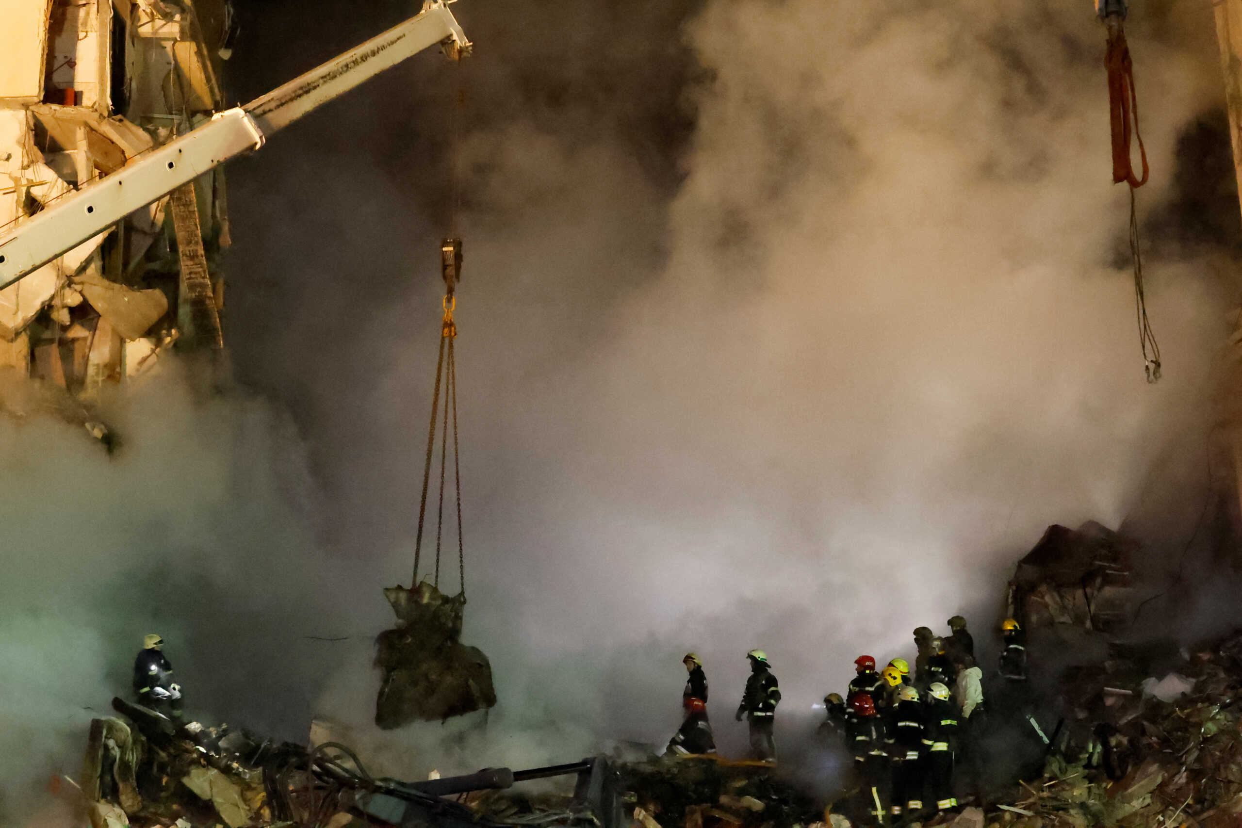 Emergency personnel work at the site where an apartment block was heavily damaged by a Russian missile strike, amid Russia's attack on Ukraine, in Dnipro, Ukraine January 15, 2023. REUTERS