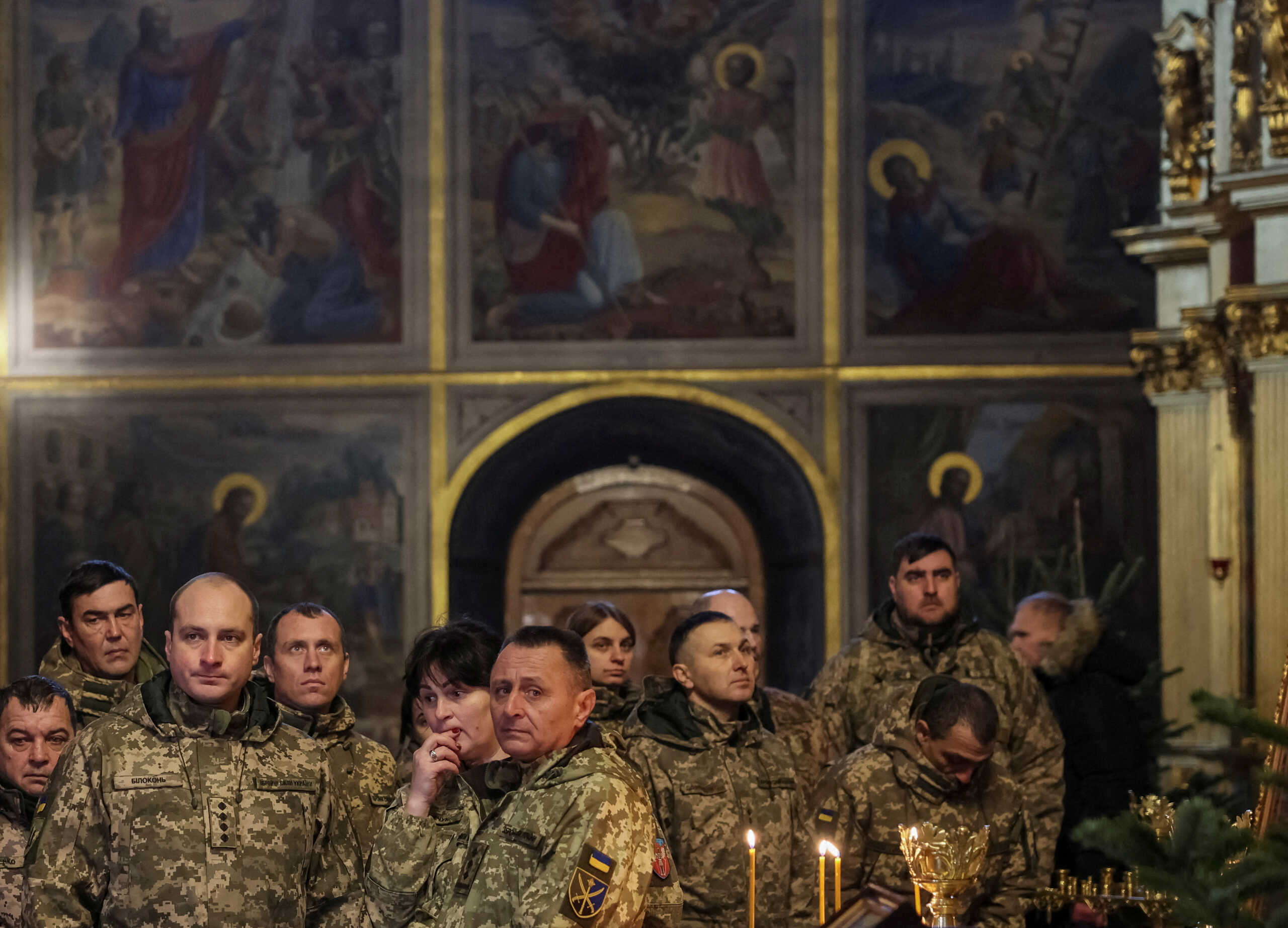 Ukrainian servicemen attend a special service for Ukrainian Armed Forces at Mikhailovsky Zlatoverkhy Cathedral (St. Michael's Golden-Domed Cathedral) inaugurating Orthodox Christmas celebrations, amid Russia's attack on Ukraine, in central Kyiv, Ukraine January 6, 2023. REUTERS