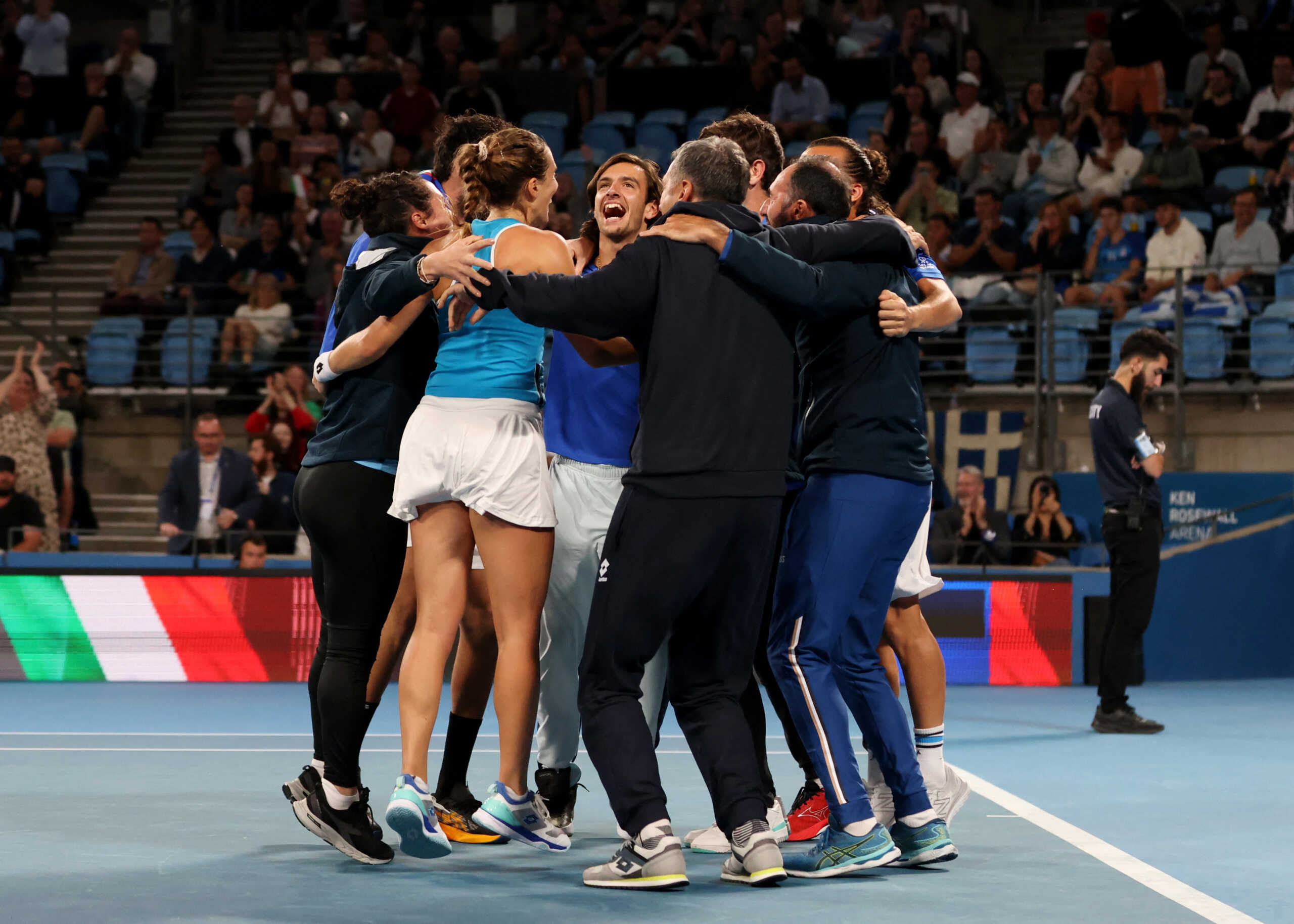Tennis - United Cup - Ken Rosewall Arena, Sydney, Australia - January 7, 2023  Italy's Lucia Bronzetti celebrates with teammates after winning her match in the semi final against Greece's Valentini Grammatikopoulou REUTERS