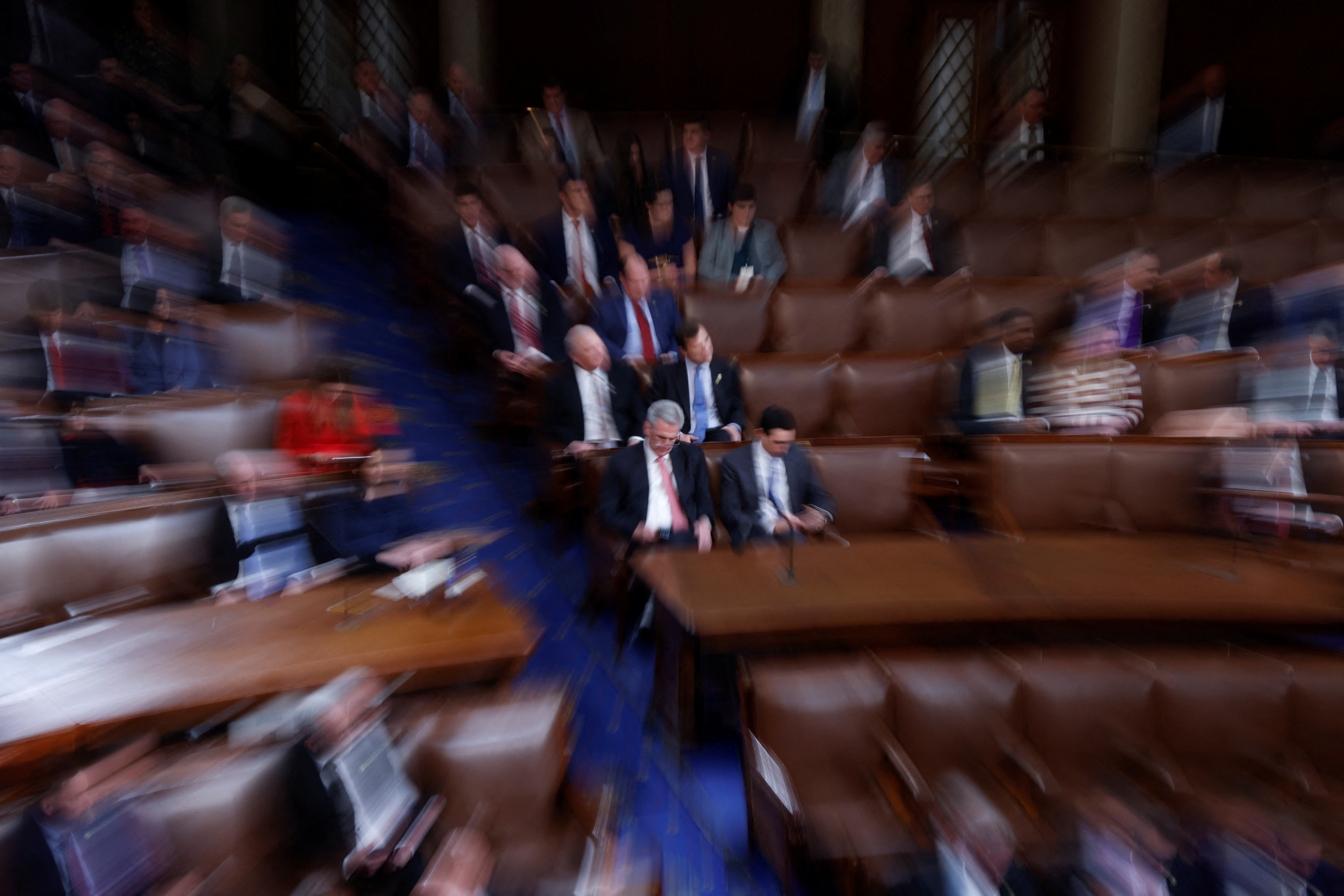 House Republican Leader Kevin McCarthy (R-CA) sits at the center of the House floor as rounds of voting continue in the election of a new Speaker of the House on the third day of the 118th Congress at the U.S. Capitol in Washington, U.S., January 5, 2023. Picture taken while zooming during a long exposure. REUTERS