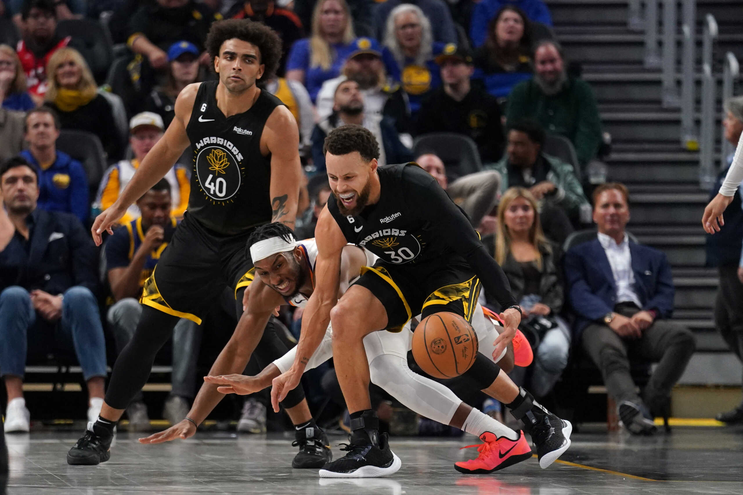 Jan 10, 2023; San Francisco, California, USA; Golden State Warriors guard Stephen Curry (30) is fouled by Phoenix Suns guard Josh Okogie (2) in the fourth quarter at the Chase Center. Mandatory Credit: Cary Edmondson-USA TODAY Sports