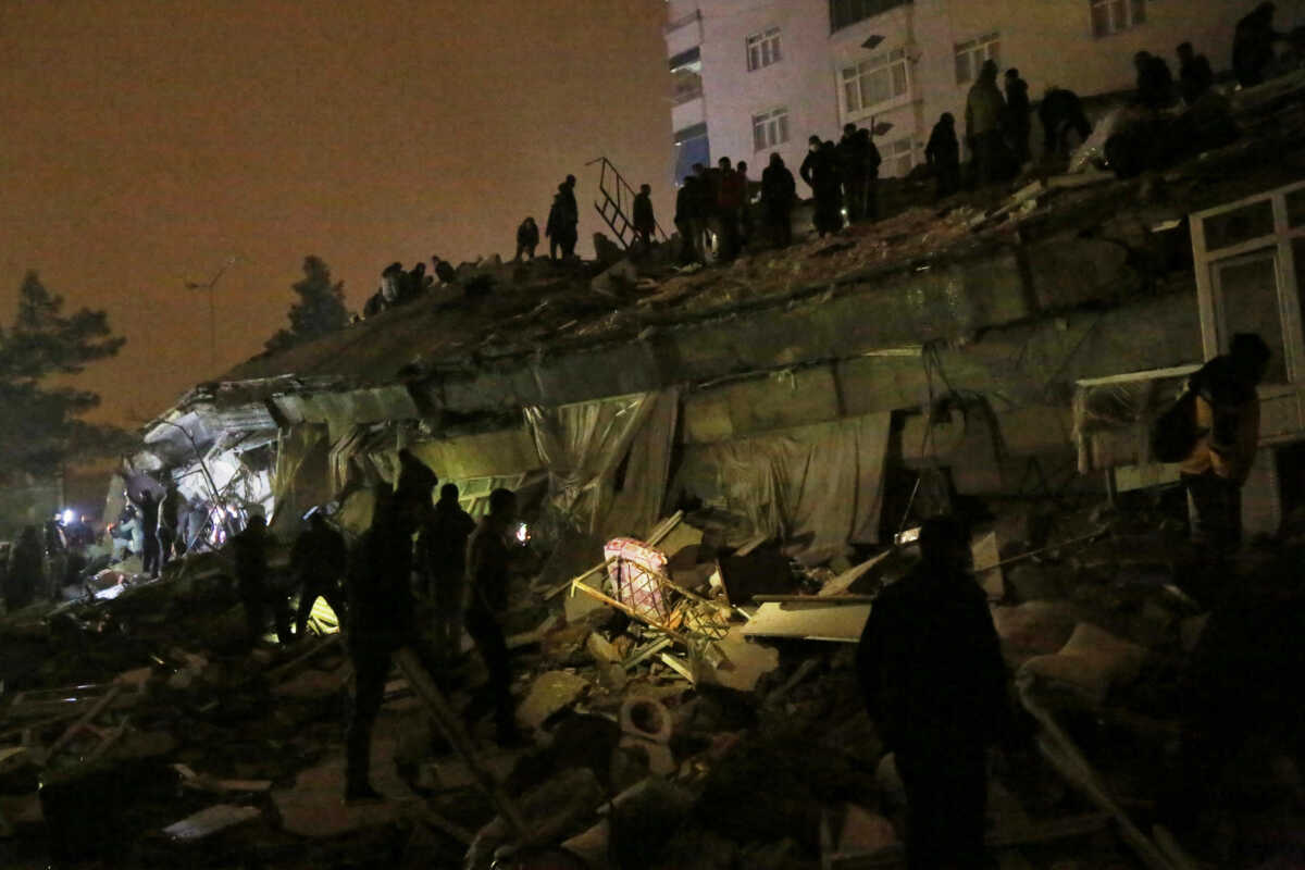 People search through rubble following an earthquake in Diyarbakir, Turkey February 6, 2023. REUTERS