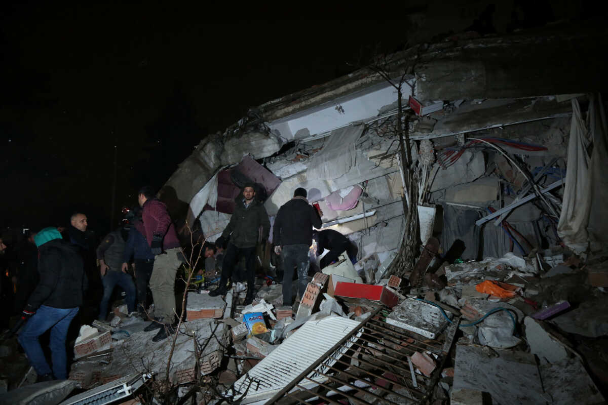 People search through rubble following an earthquake in Diyarbakir, Turkey February 6, 2023. REUTERS